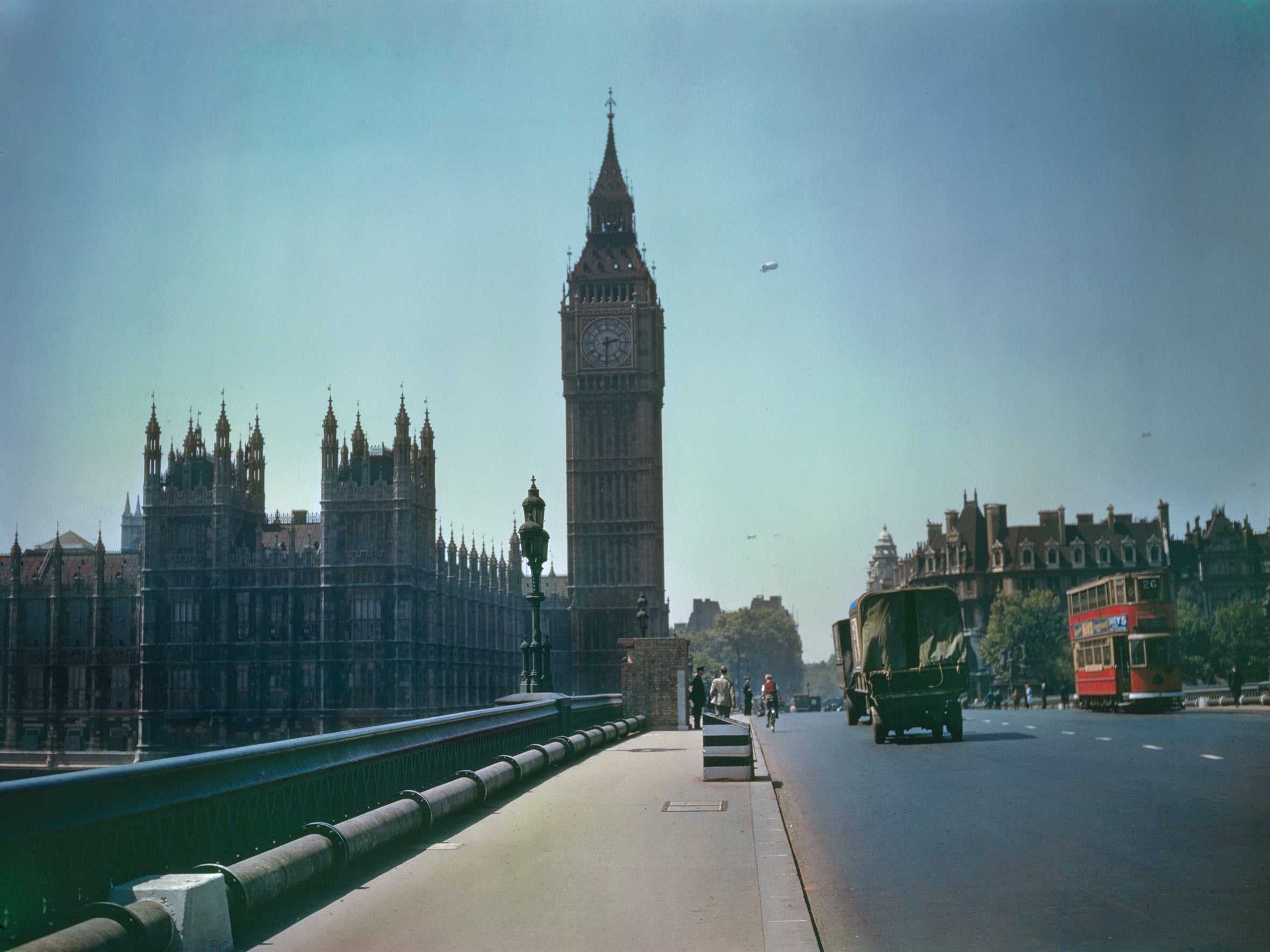 TR 1114: Big Ben and the Houses of Parliament in London with barrage balloons in the background, seen from Westminster Bridge