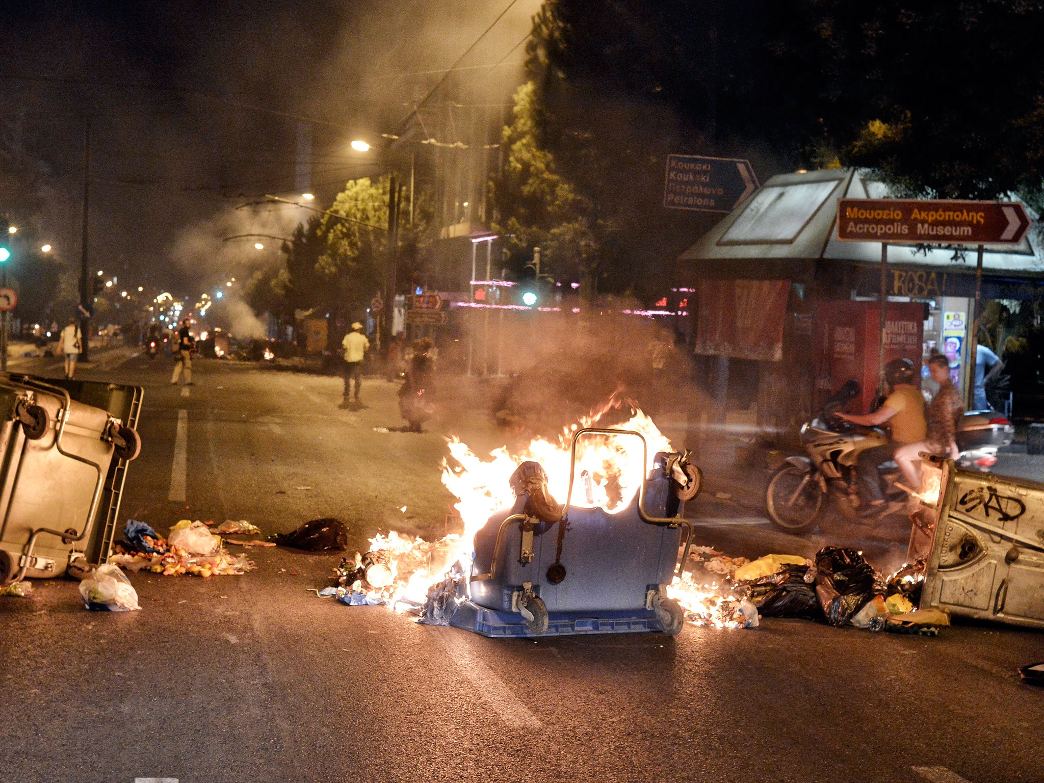 Protesters set fire to bins