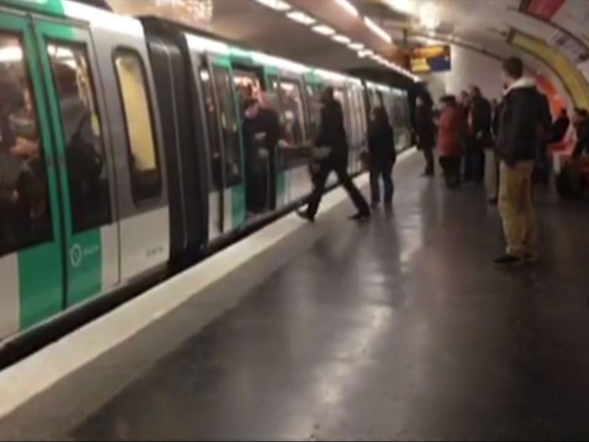 Chelsea fans are shown stopping Souleymane Sylla from boarding a Paris Metro train