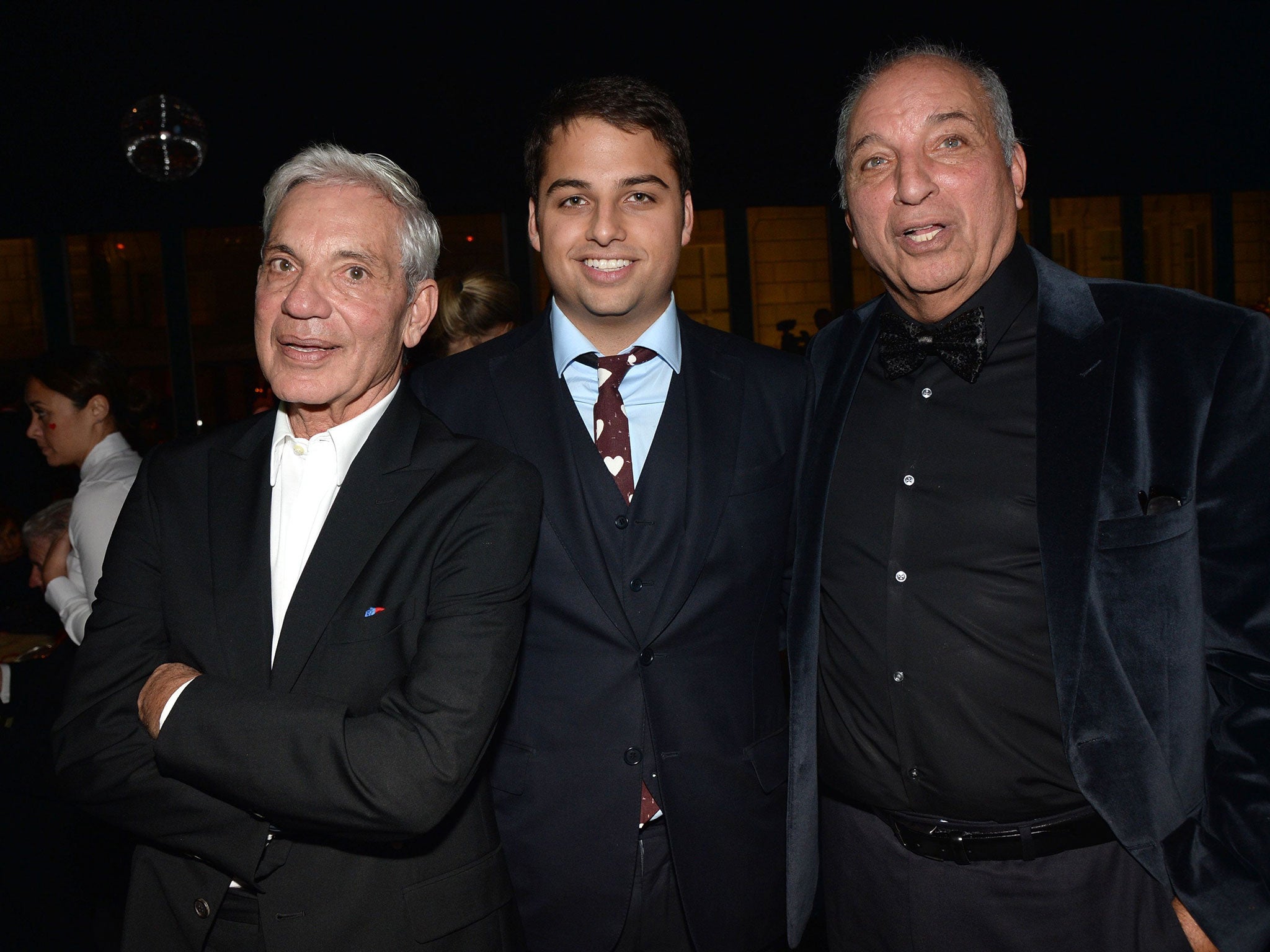 Simon, left, and David Reuben, right, with David’s son Jamie, centre