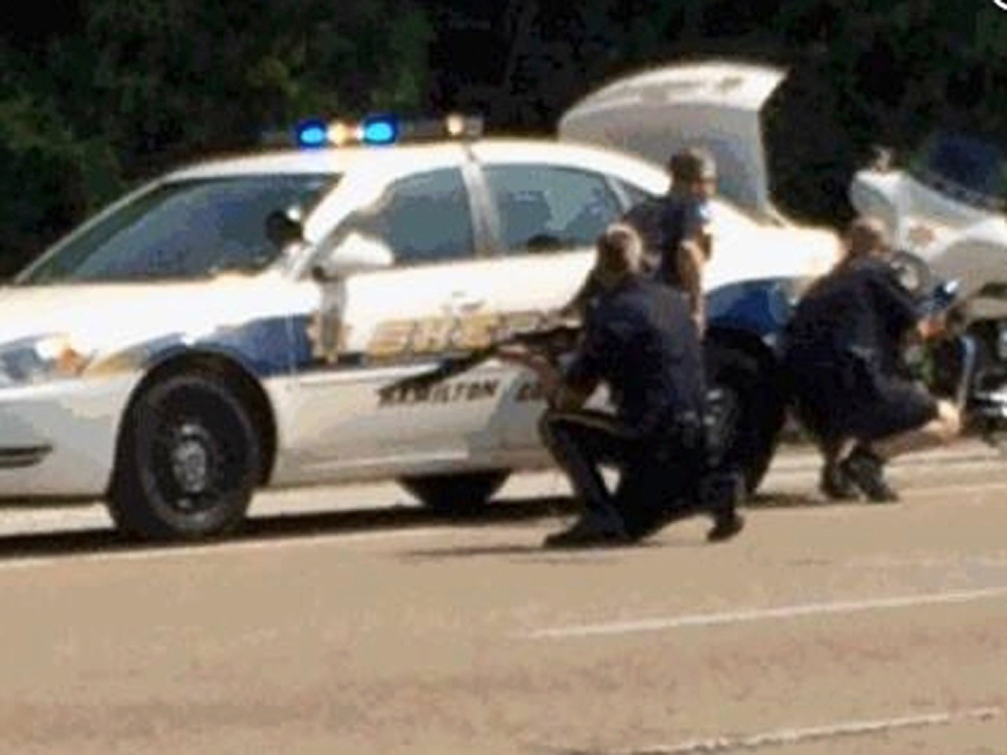 Cops taking cover after a shooter opened at military offices in Chattanooga