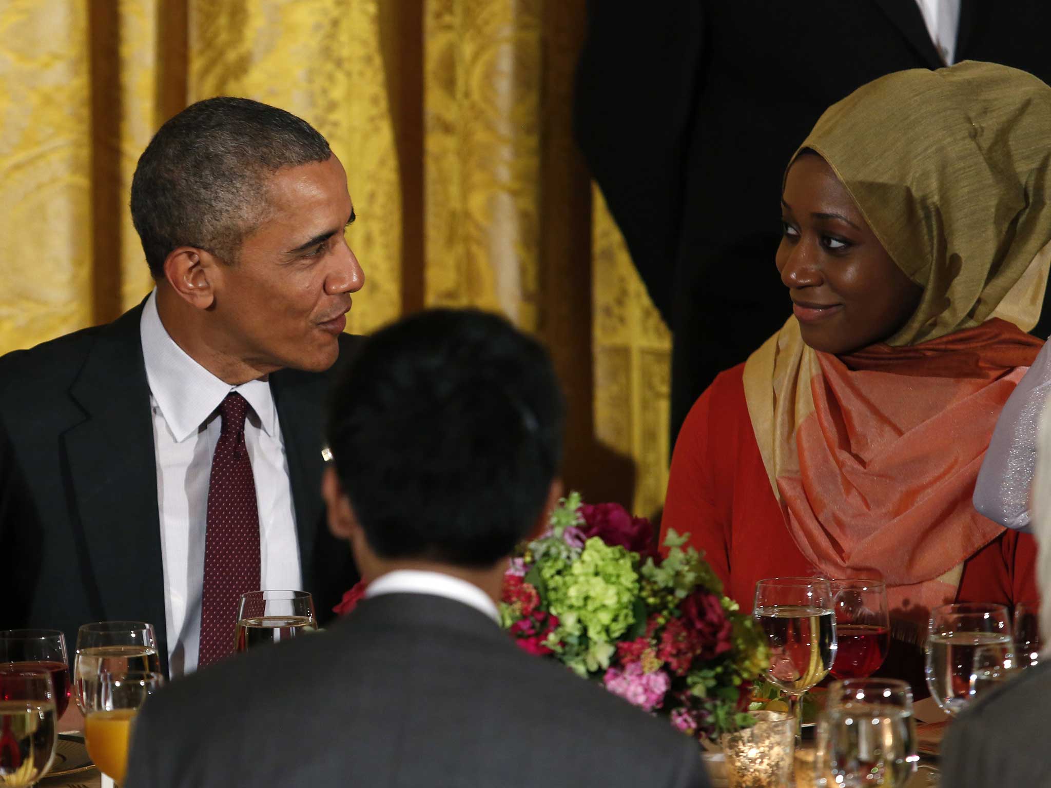 US President Barack Obama talk to a guest during a White House celebration of Ramadan in June