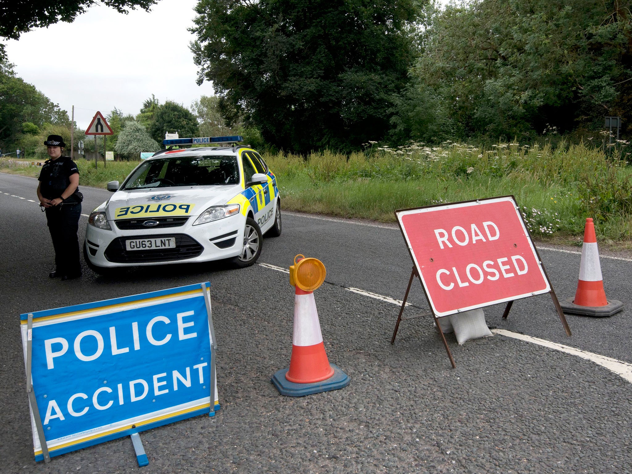 Police close to the scene where a man was stabbed to death by another motorist in Findon, West Sussex