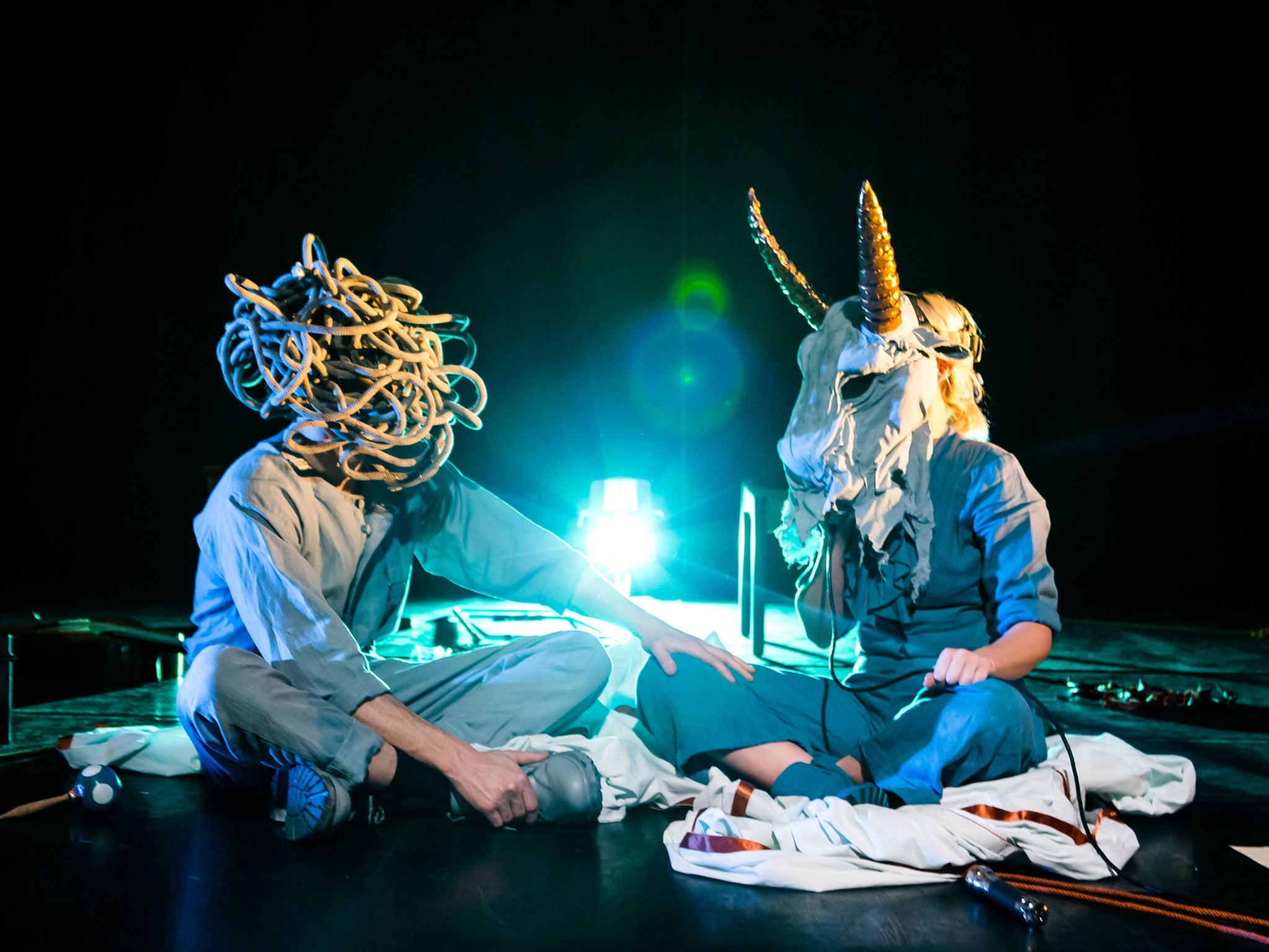 Tim and Bryony on stage in the masks they use to represent different periods in his story – and keep Tim from having to look the audience in the eye