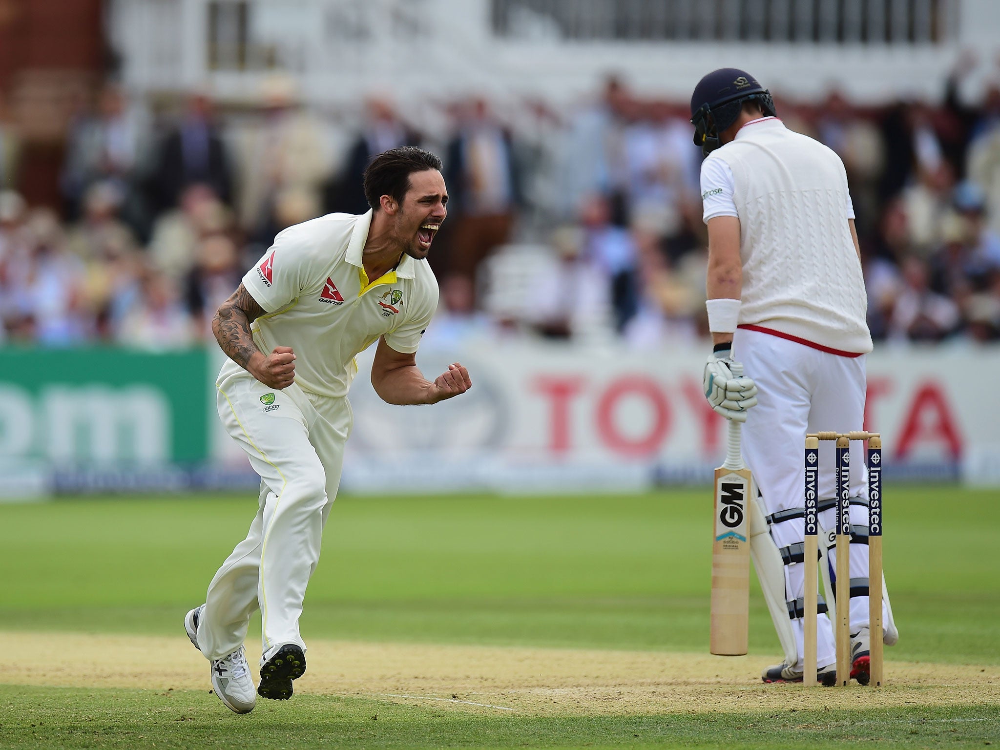 Johnson celebrates after taking the wicket of Joe Root