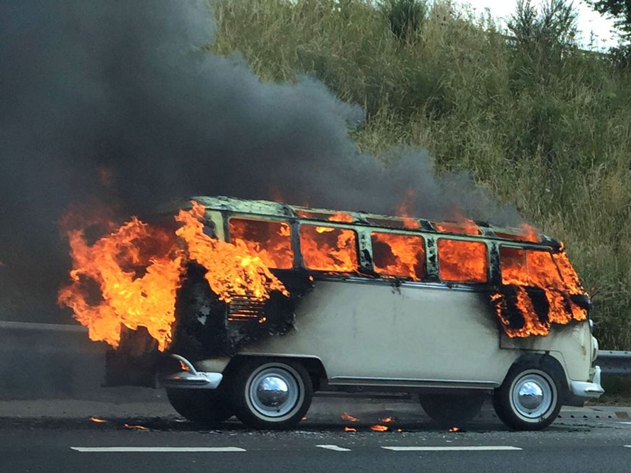 A VW camper van on fire on the M62 at junction 29, near Leeds which reduced traffic to a crawl on the major motorway.