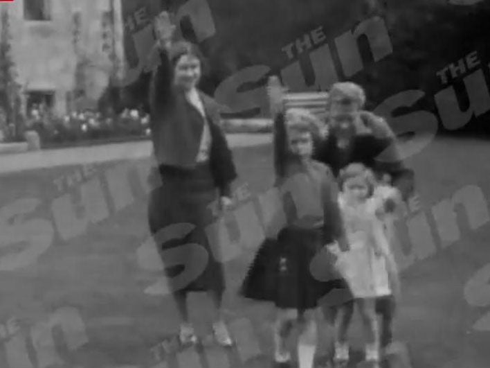 The footage appears to show Princess Elizabeth, her mother and uncle performing the salute