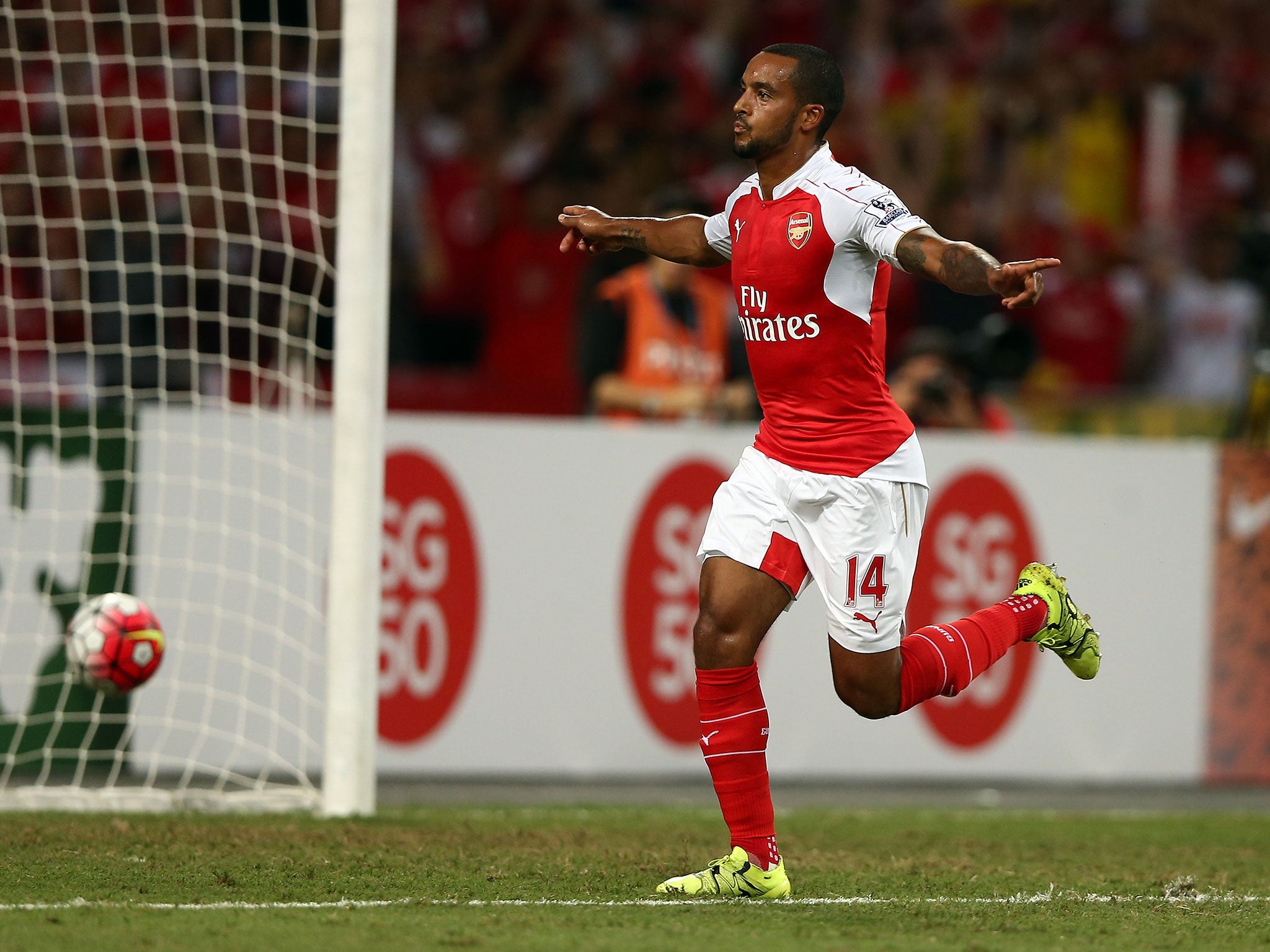 Theo Walcott celebrates scoring for Arsenal against Everton