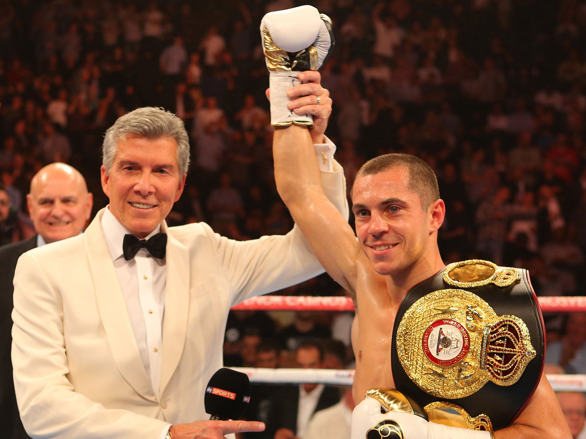 Legendary announcer Michael Buffer raises Scott Quigg's arm in victory