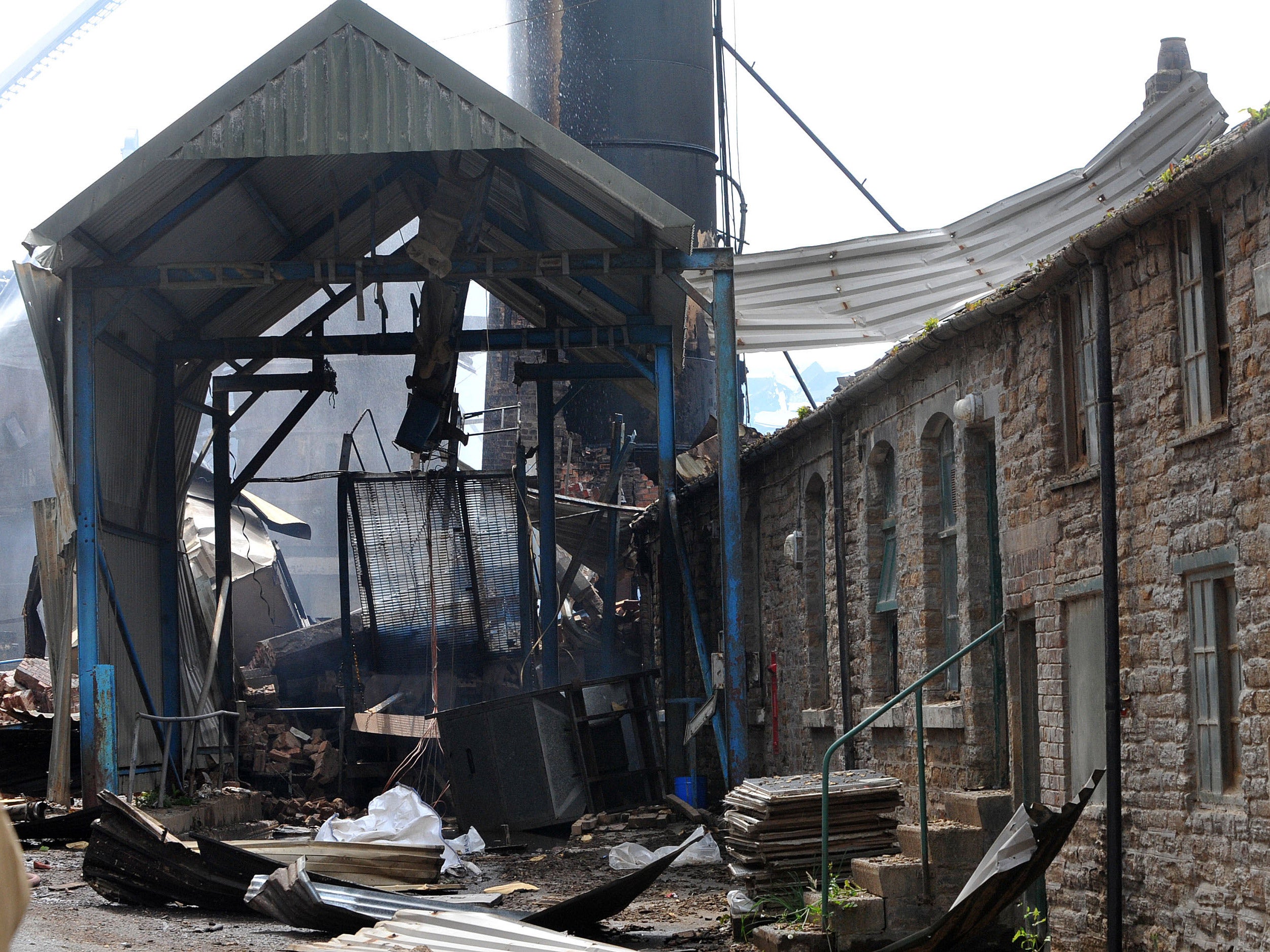 Four workers are still missing inside the mill