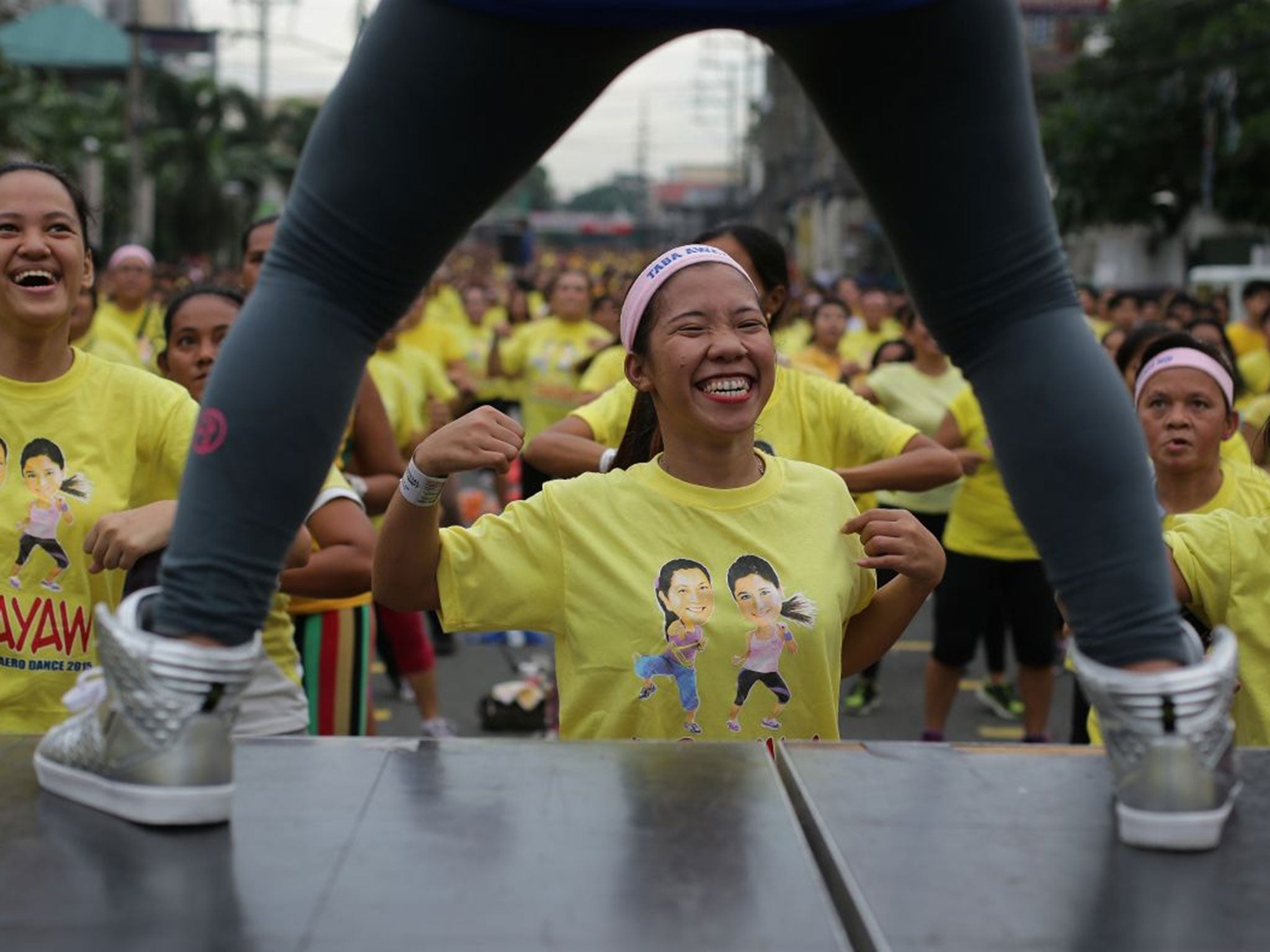 A woman takes part in the record-breaking Zumba class (Image: Aaron Favila/AFP)