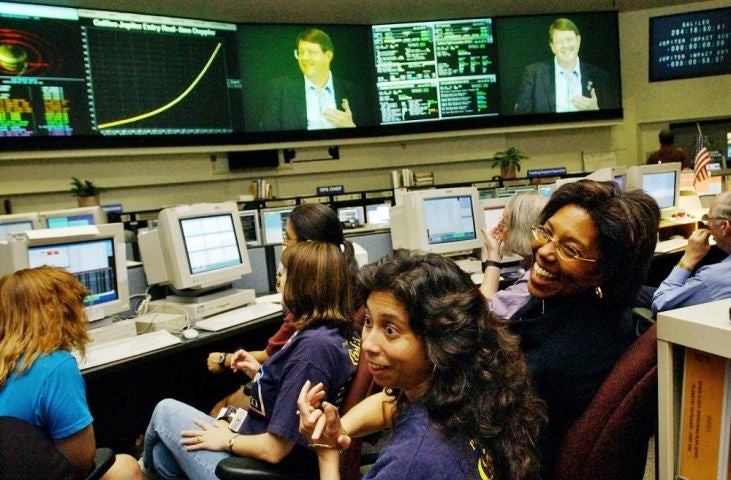 Doctor Claudia Alexander smiling (furthest right)