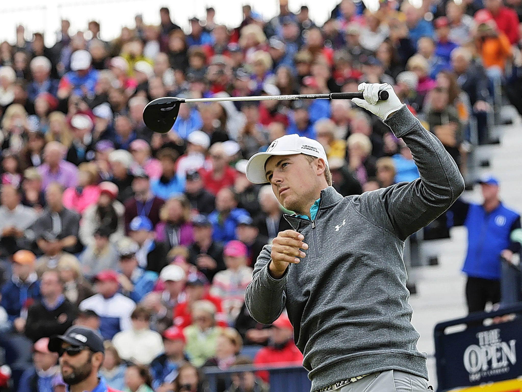 Jordan Spieth watches his tee shot on the 17th during Sunday’s third round of the Open