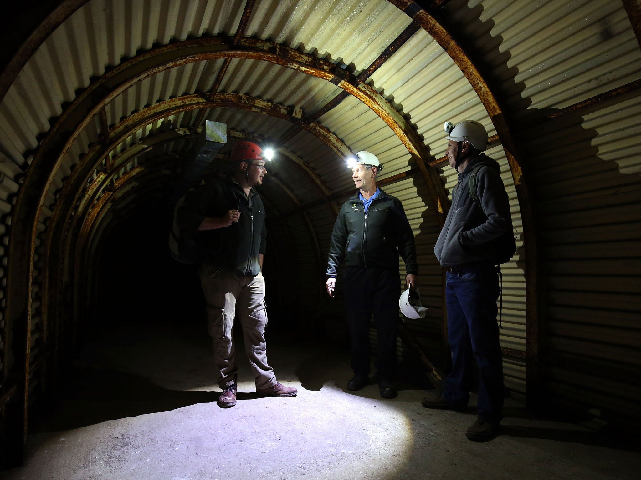 National Trust staff explore the Fan Bay Deep Shelter in Dover where relics and drawings were found