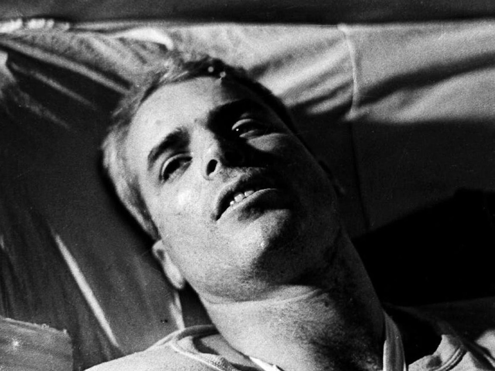 McCain, pictured in hospital in Hanoi in 1967, followed his father and grandfather into the Navy (Hulton)