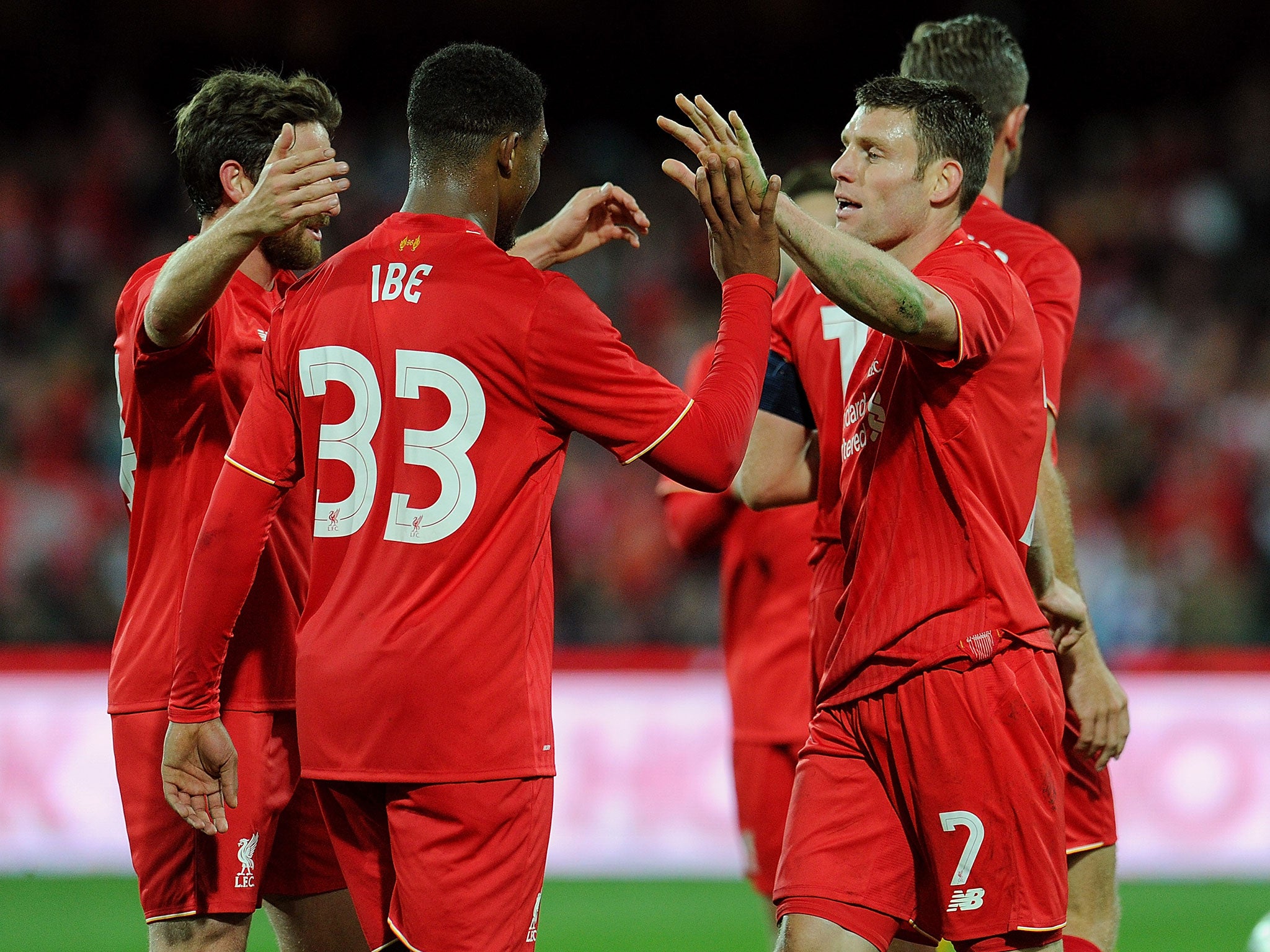 James Milner celebrates with Jordon Ibe, who set up the goal