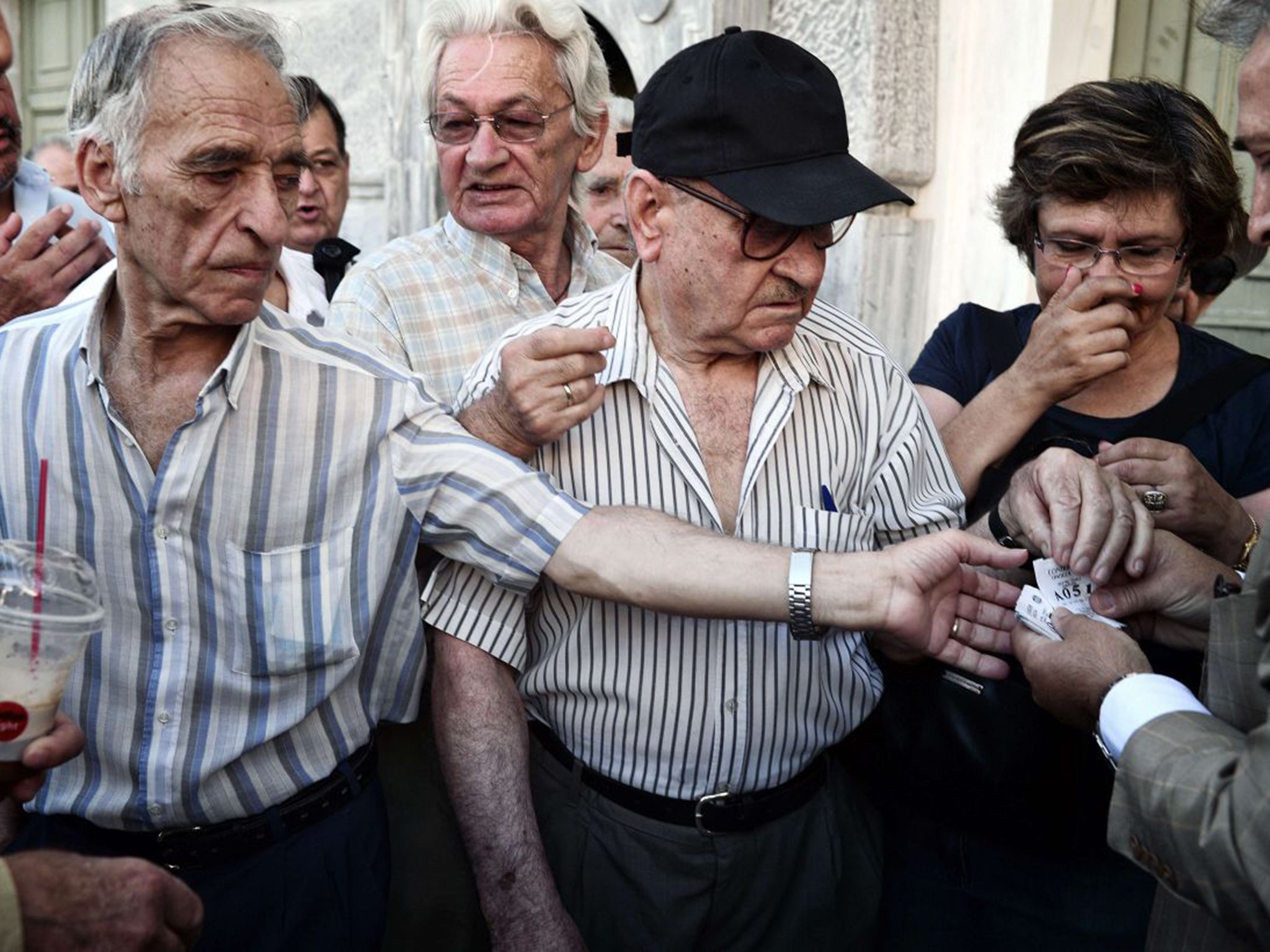 Elderly people received priority numbers as they queued for banks to re-open