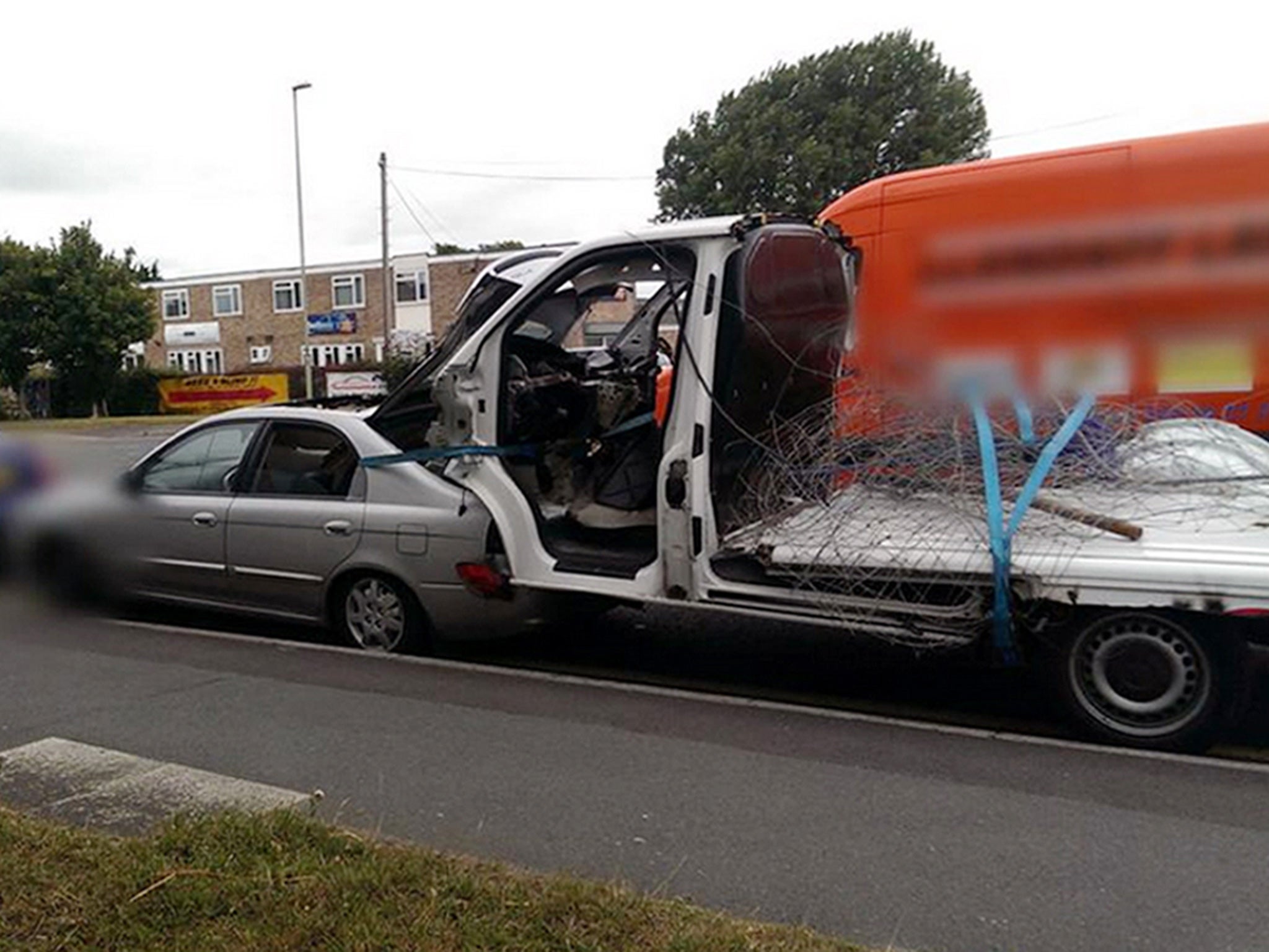 The flatbed truck being towed by a car when it was stopped by police in Gloucester