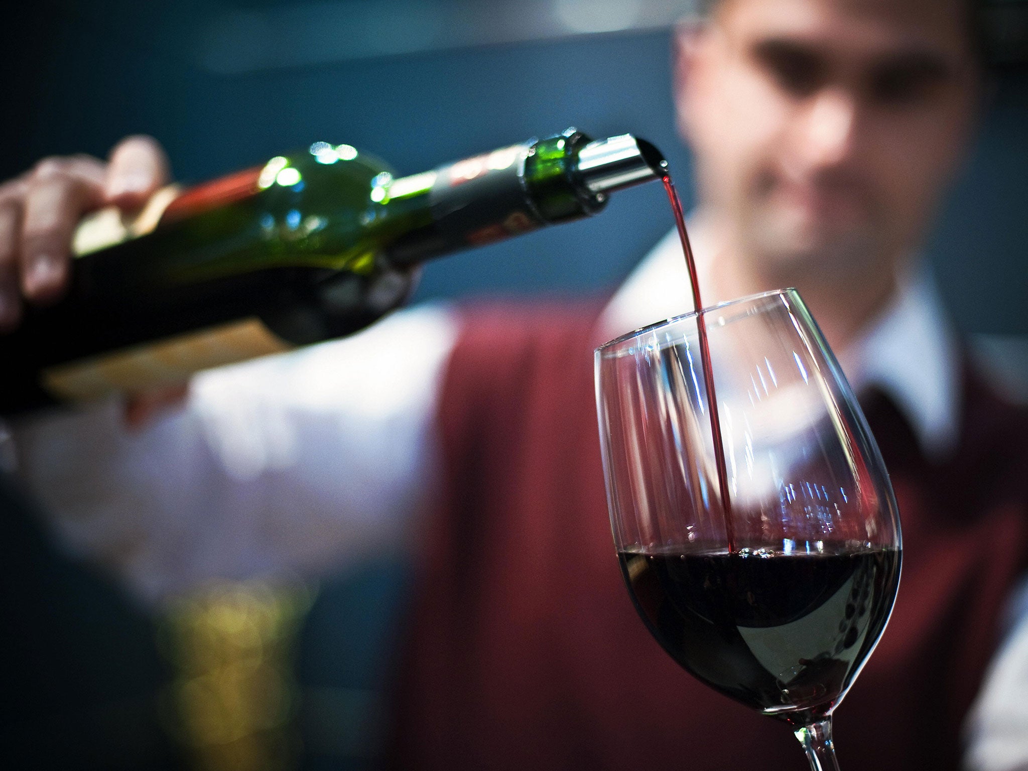 A man fills a glass with a red wine during the annual Winery 2009 international wine fair in the central Bulgarian city of Plovdiv on March 18, 2009. More than 300 companies from 19 countries are participating in the 17th consecutive edition of the exhibi