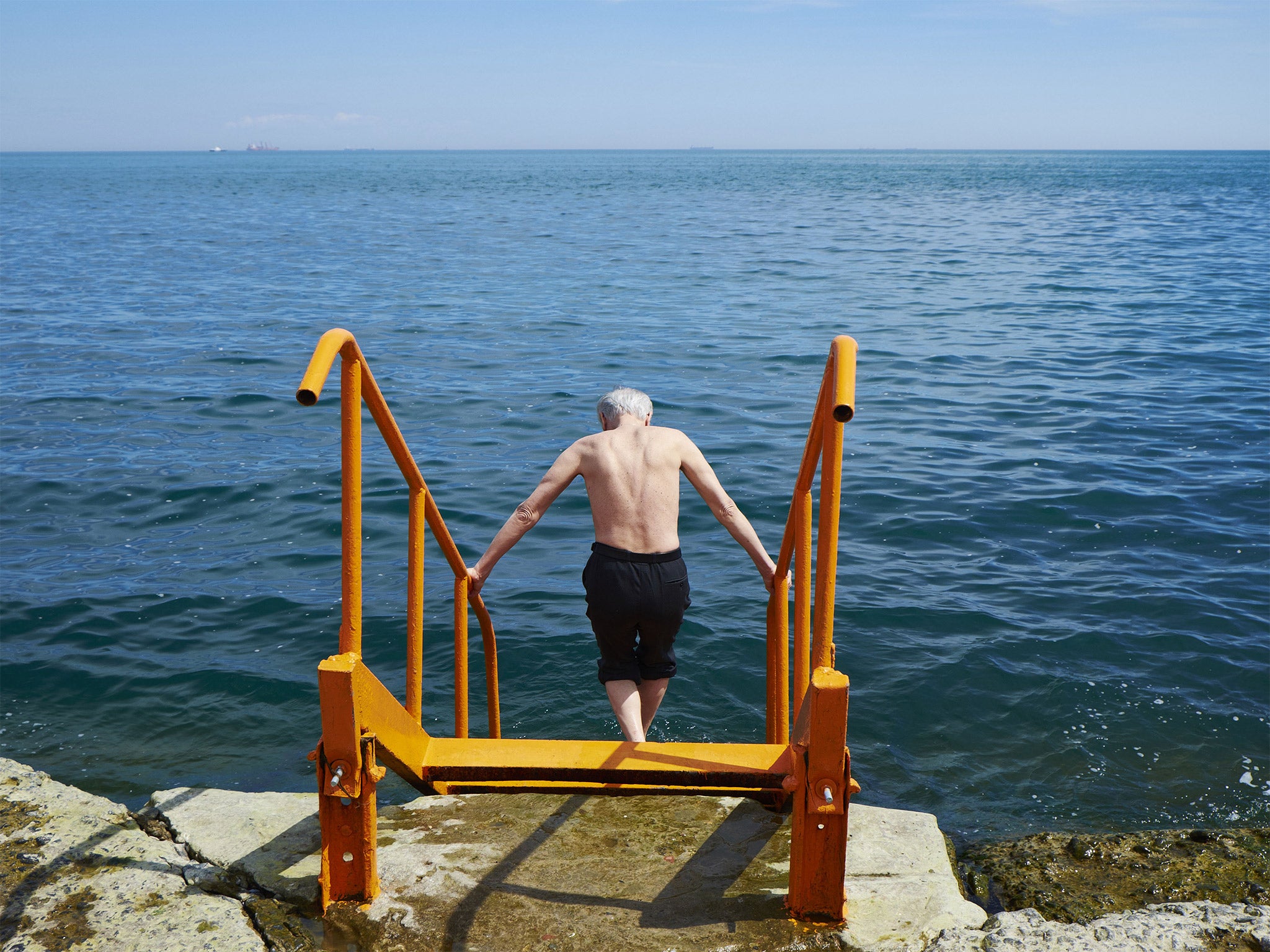 A man goes for a swim in the Black Sea, in Odessa, Ukraine (Getty)