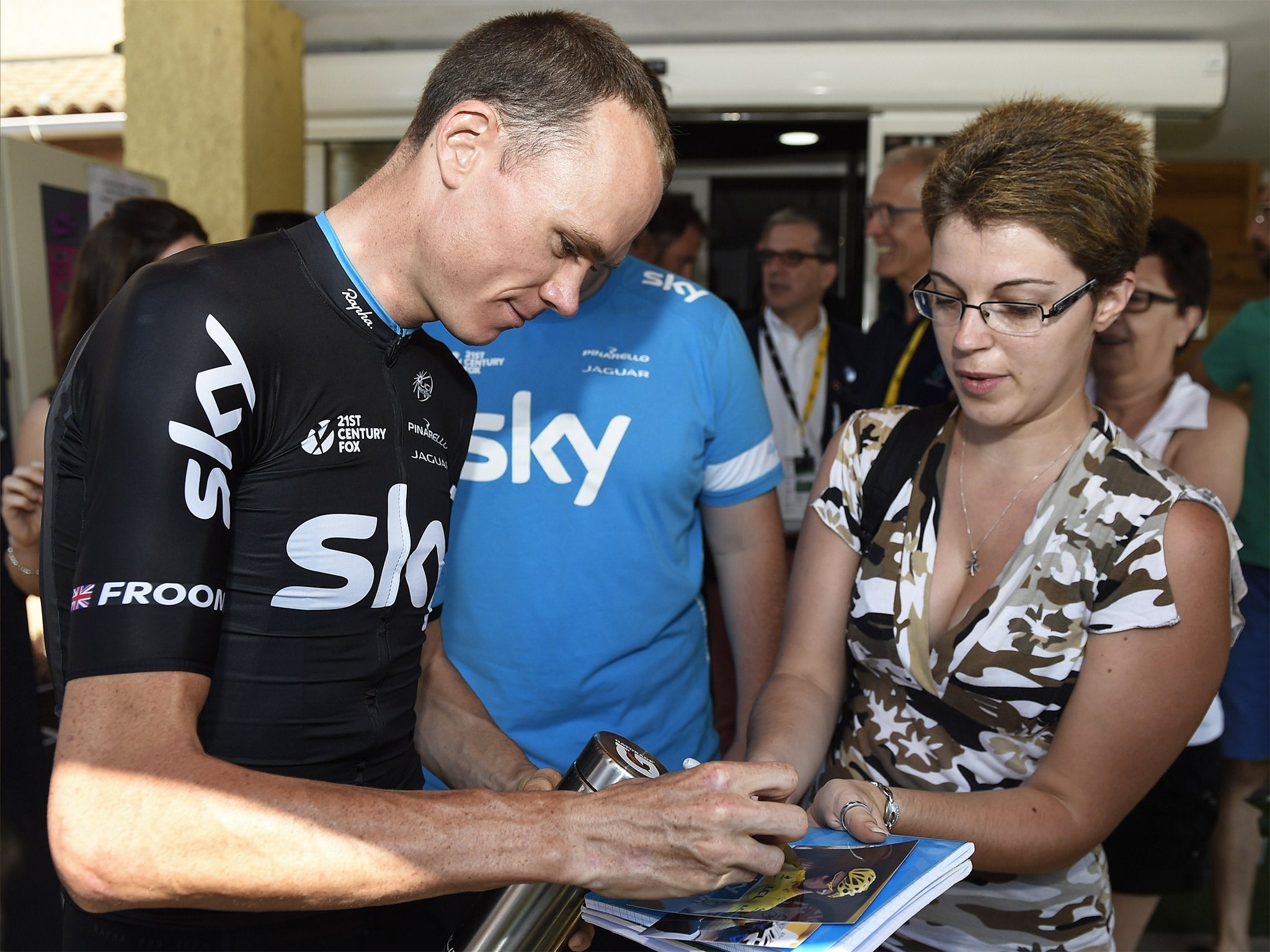 Chris Froome signs autographs at Team Sky’s hotel during the Tour de France rest day