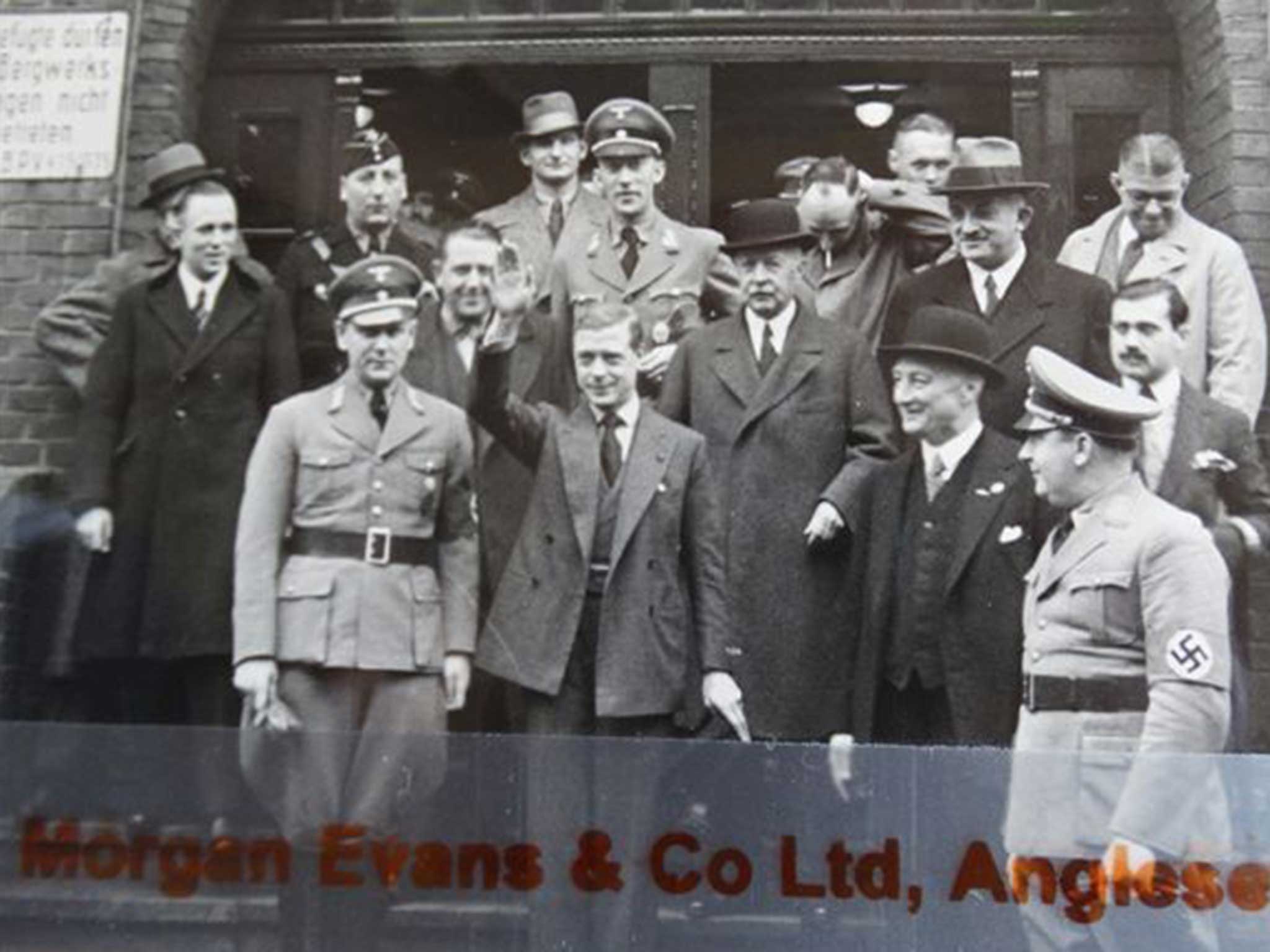 The Duke appears to give the salute, surrounded by German Nazi officials