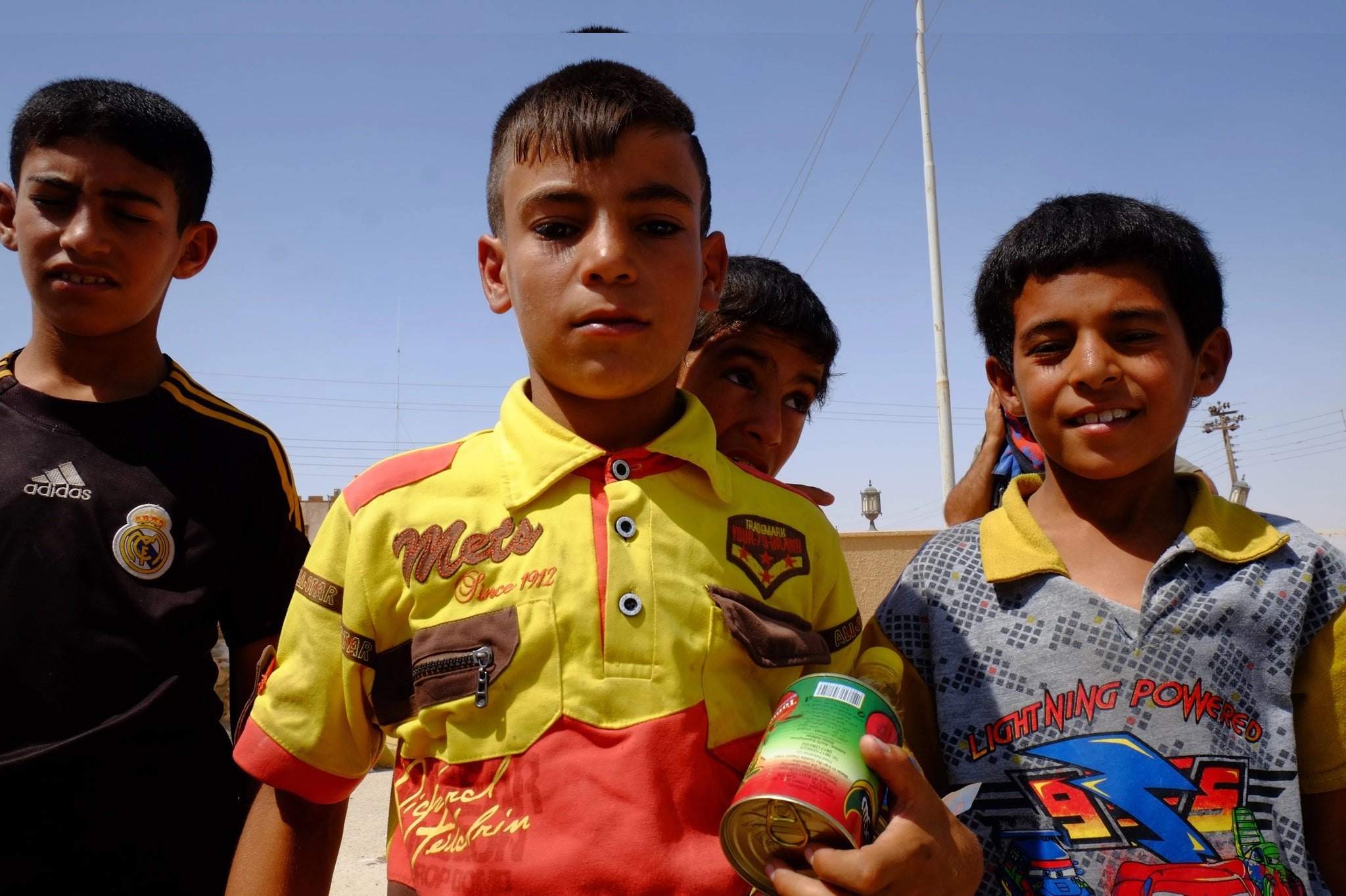 Young boys in Haditha with food delivered by local charities