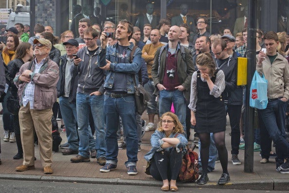 Staff, students, and passers-by stood by dumb-founded as the fire ravaged the iconic building last year (via Chris Watt/Getty Images)