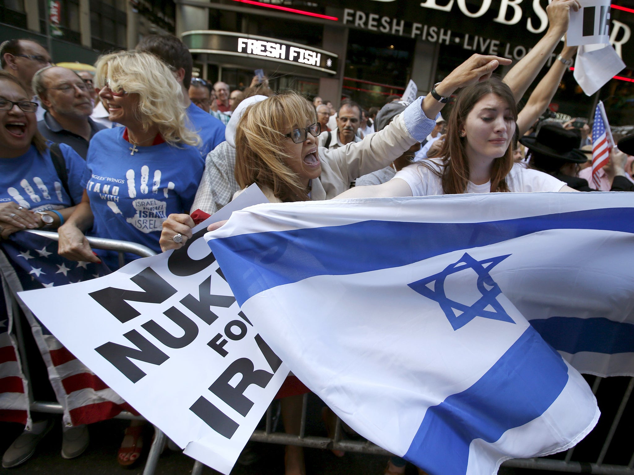 Protestors shout slogans as they demonstrate during a rally apposing the nuclear deal with Iran