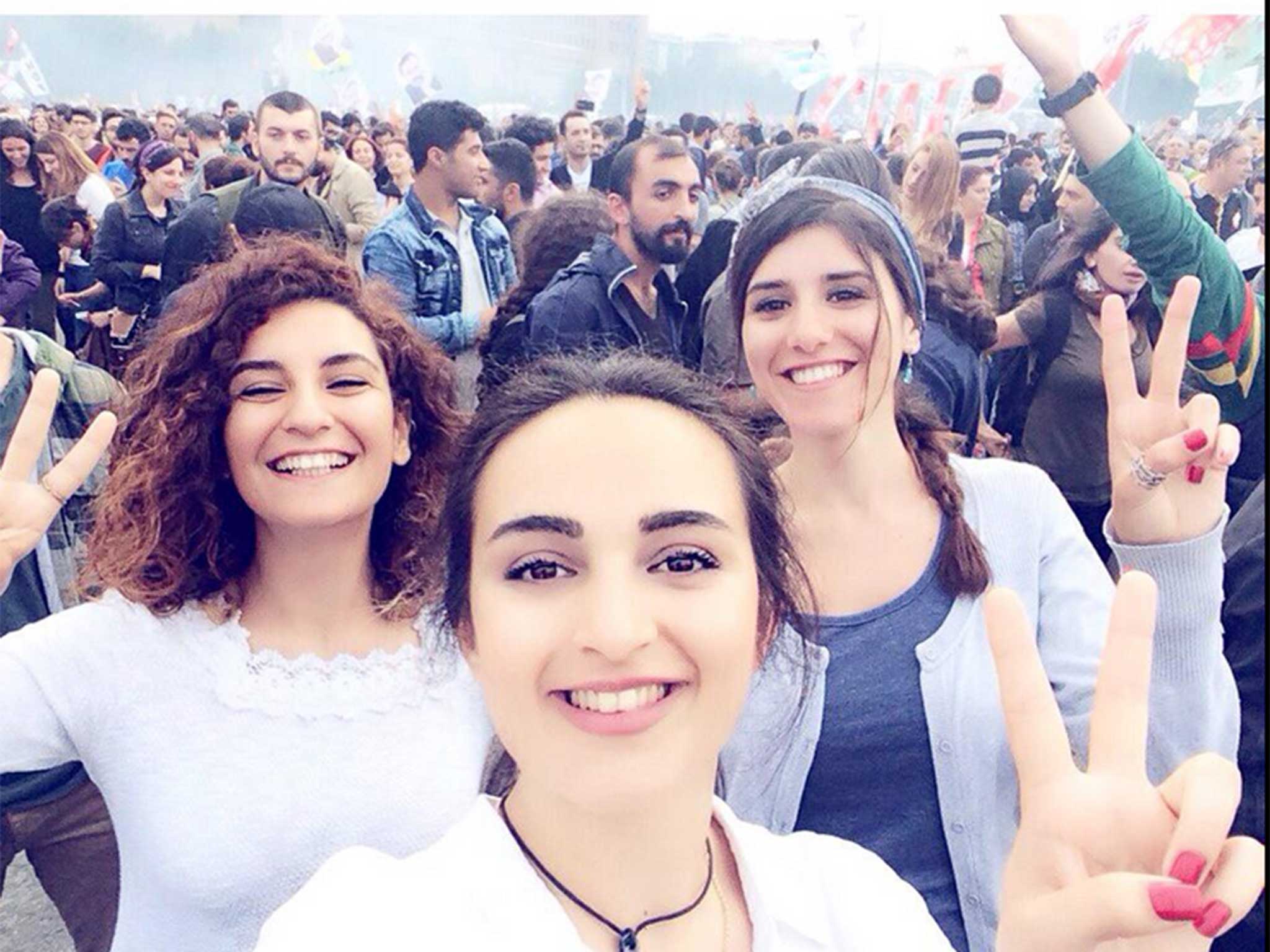 The three young women posed for the photograph a month before the attack