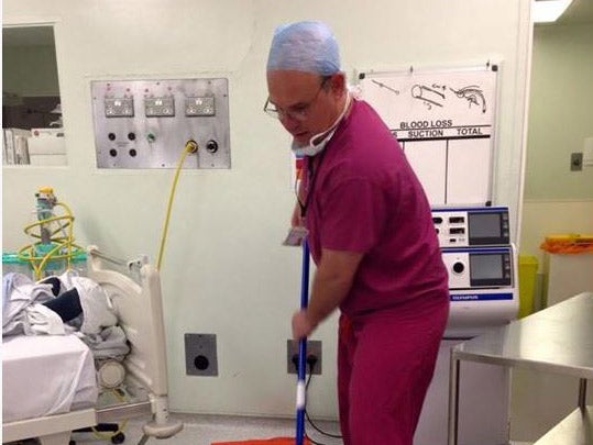 Mr Gould posted the image of himself, apparently mopping a hospital floor at 10 o'clock at night, as a thank you to his team