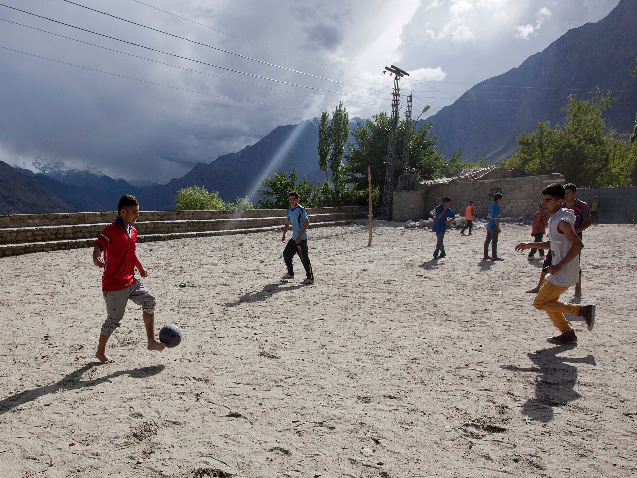 Boys play soccer on the grounds at F.G. Boys Model High School in Karimabad, Pakistan.