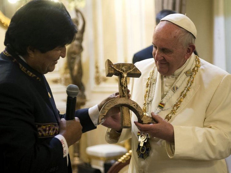 The Pope was given a crucifix attached to a Communist hammer and sickle by Bolivian President Evo Morales