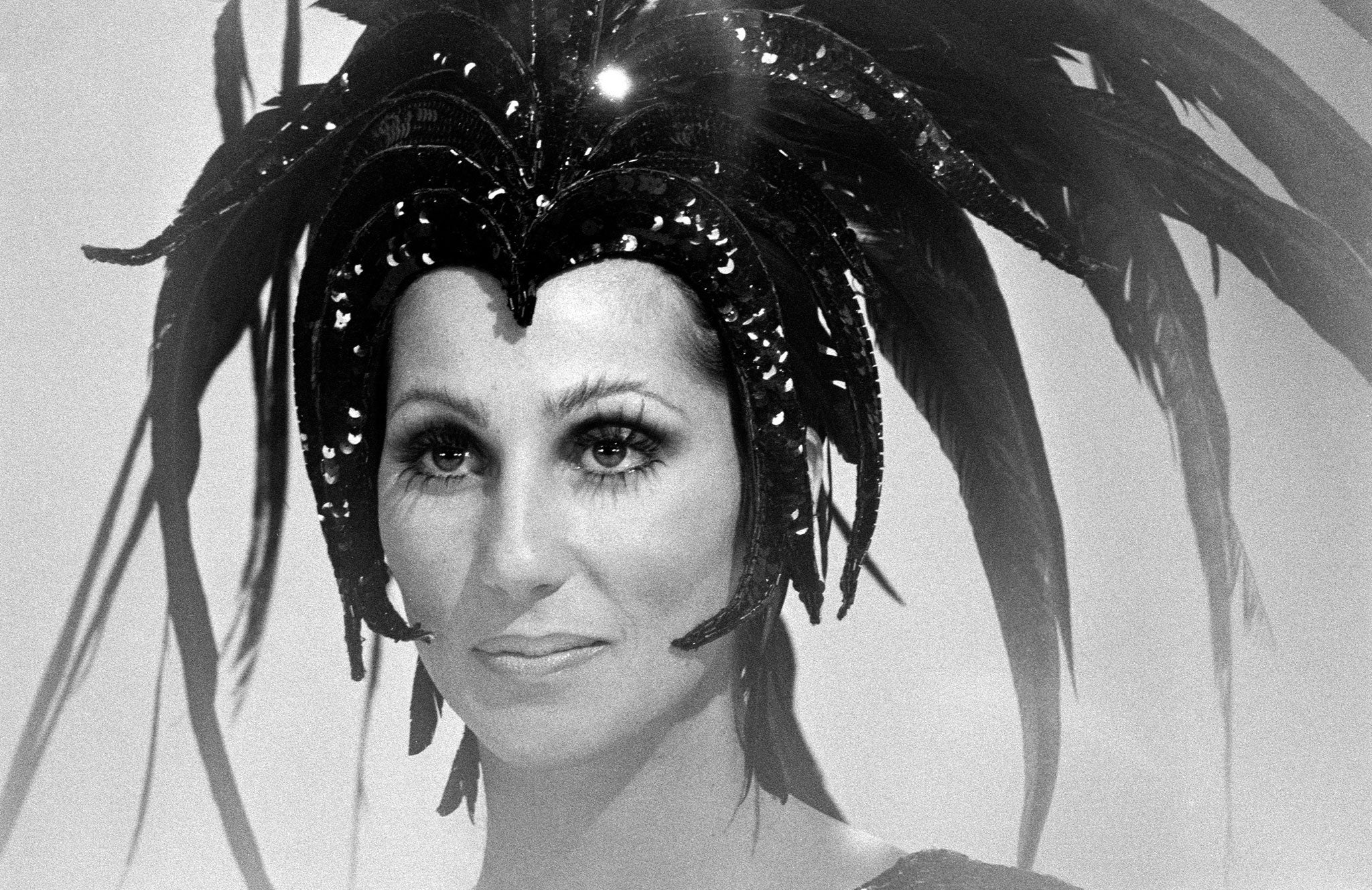 Show girl: Cher in one of her trademark feather headpieces, on the 'Sonny and Cher Comedy Hour' in 1973 (Getty)