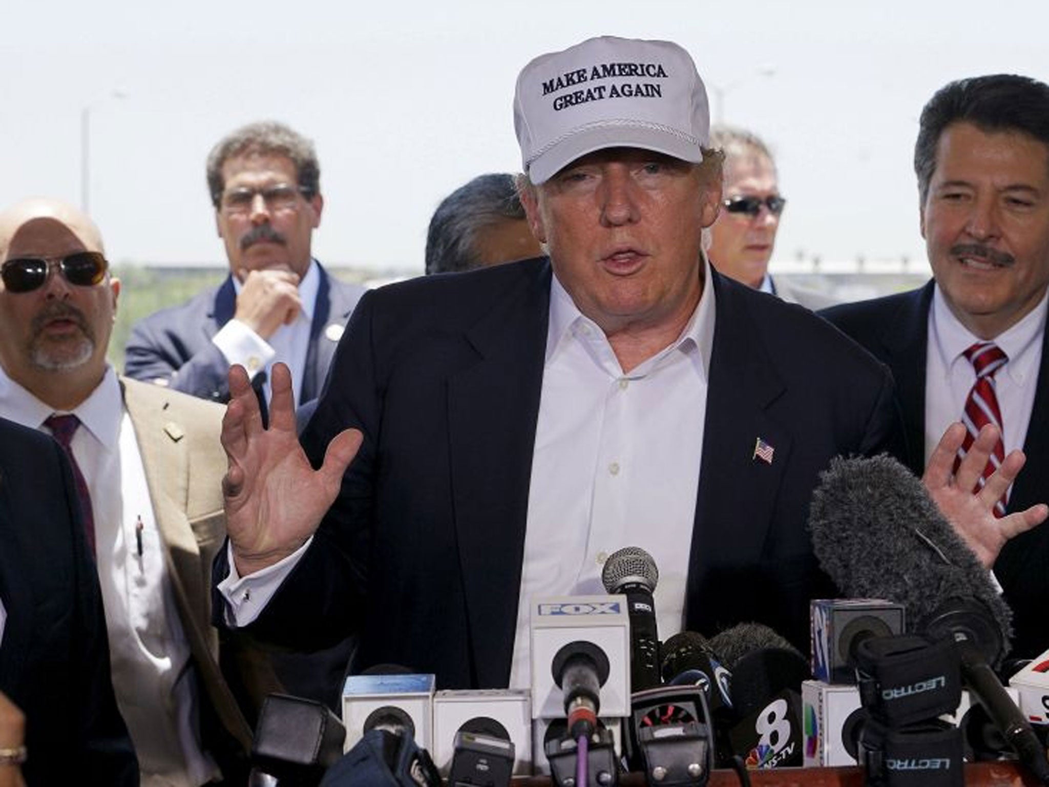 Donald Trump gestures during a news conference near the U.S.-Mexico border (Reuters)