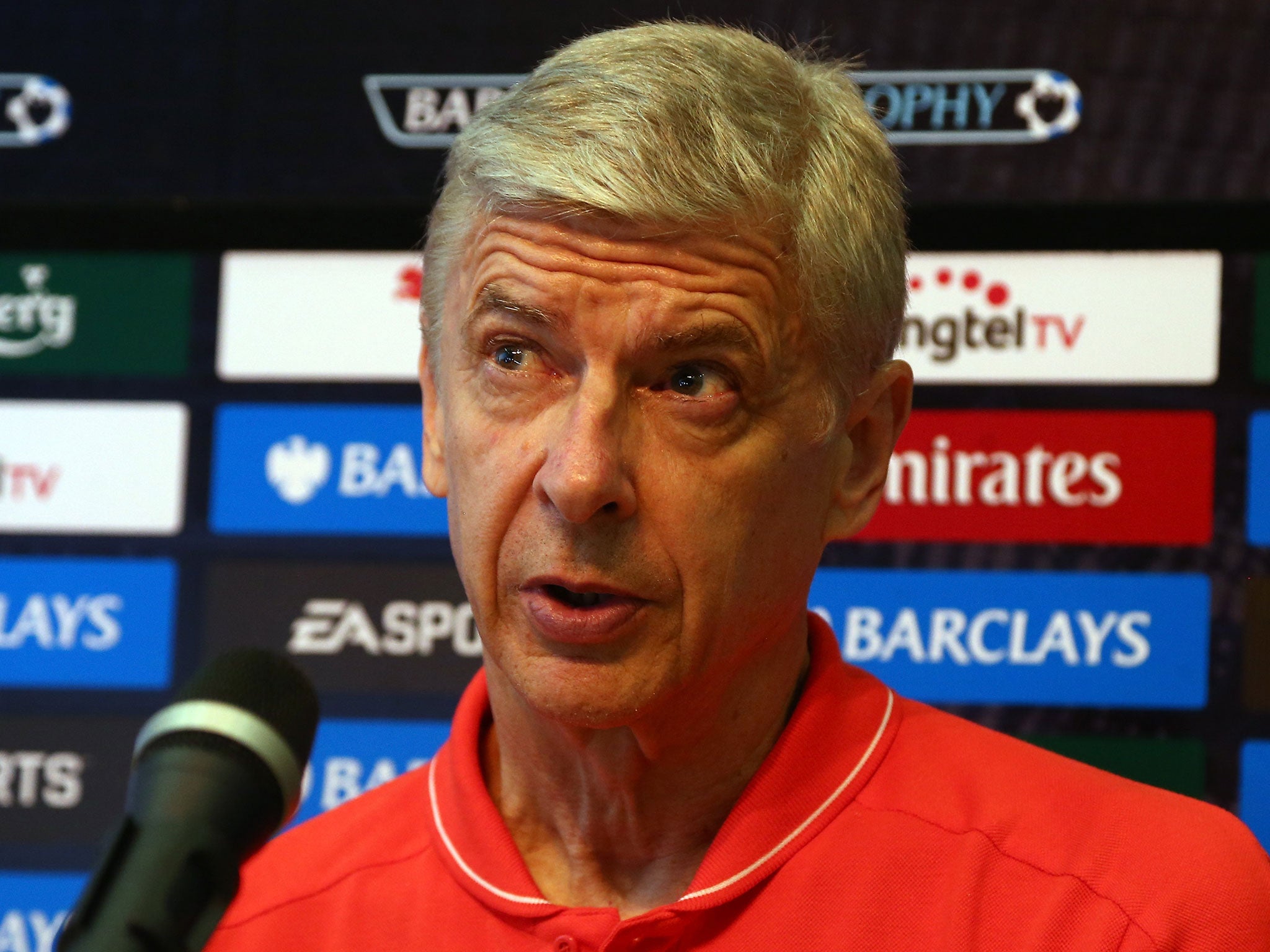 Arsene Wenger has played down the club having 'over £200m in the bank'