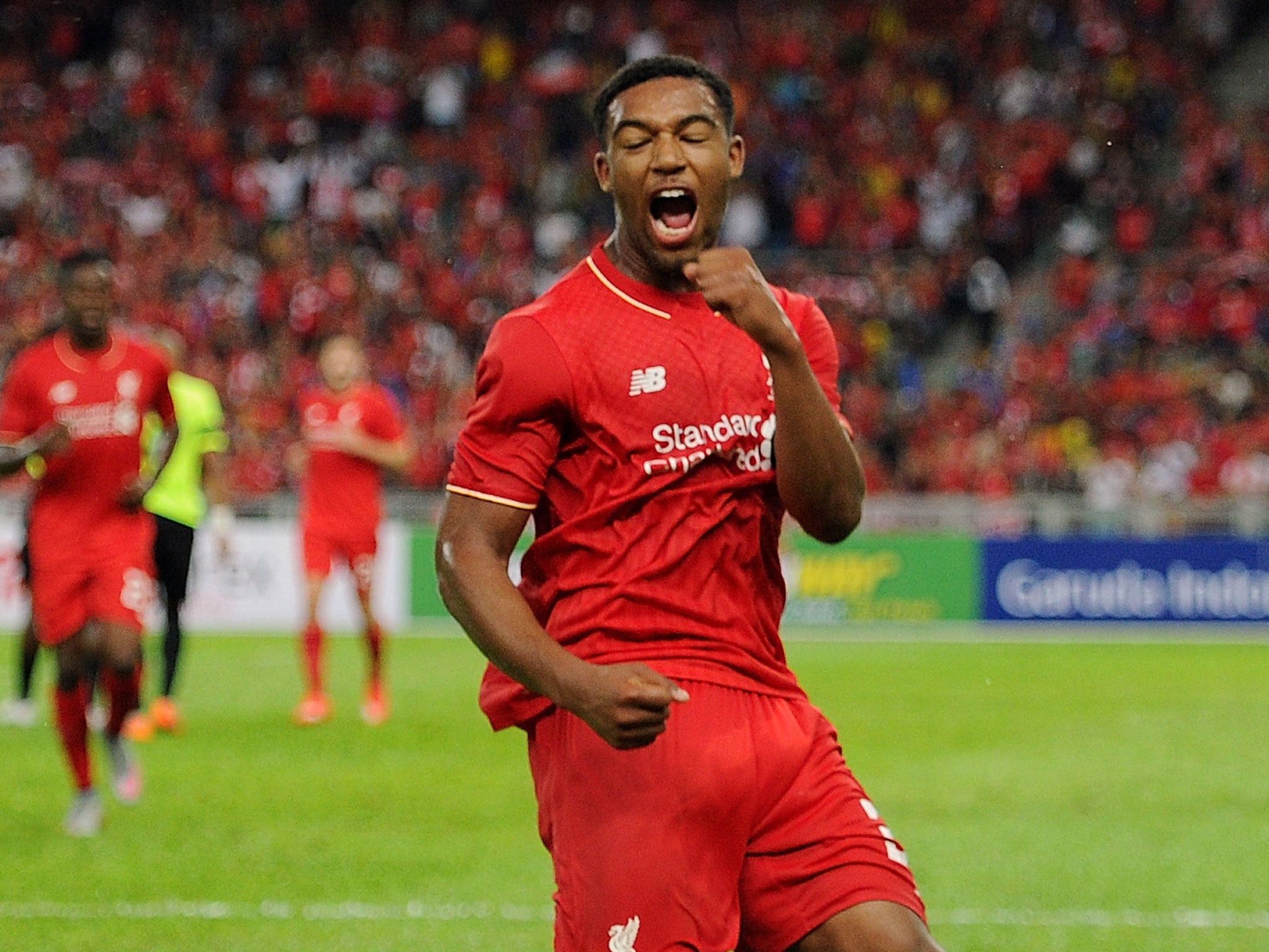 Jordan Ibe celebrates a goal against a Malaysia XI for Liverpool