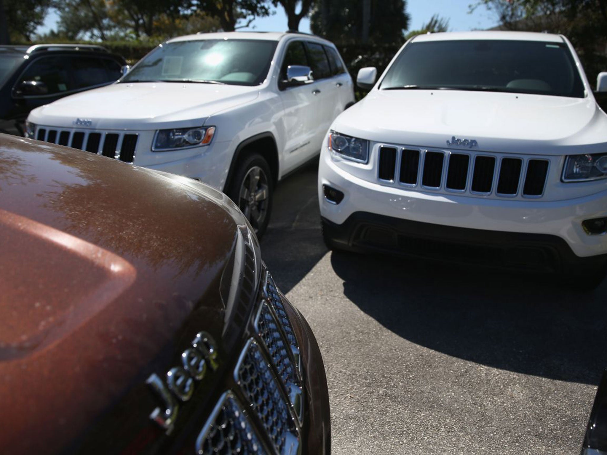 Jeep Cherokees are seen on a sales lot on April 2, 2014 in Miami, Florida