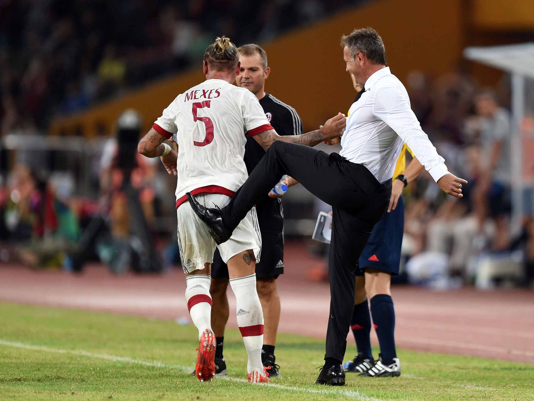 Siniša Mihajlović jokes with Philippe Mexes after his wonder-goal