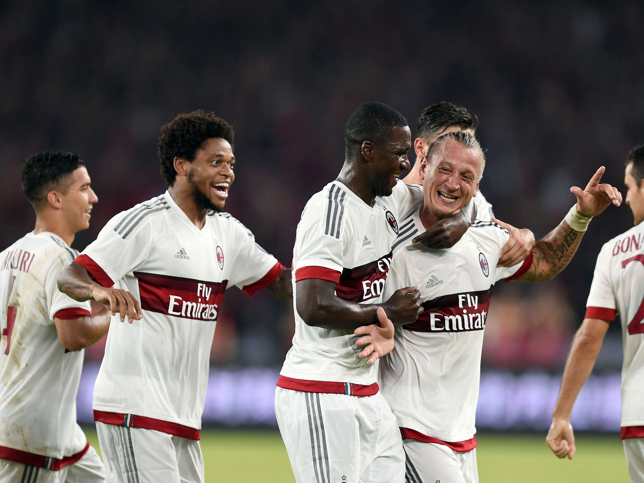 AC Milan players celebrate Philippe Mexes' goal