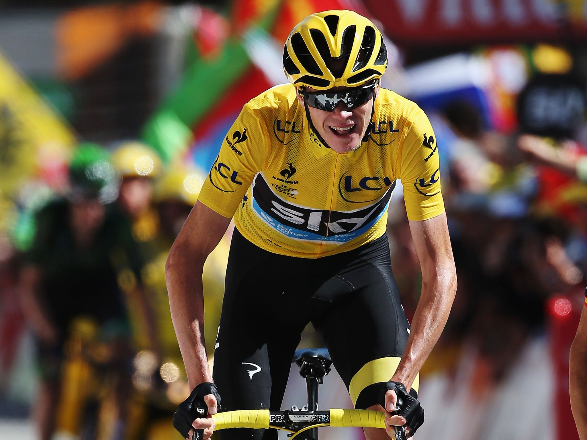 Chris Froome crosses the line on the penultimate stage of the 2015 Tour de France