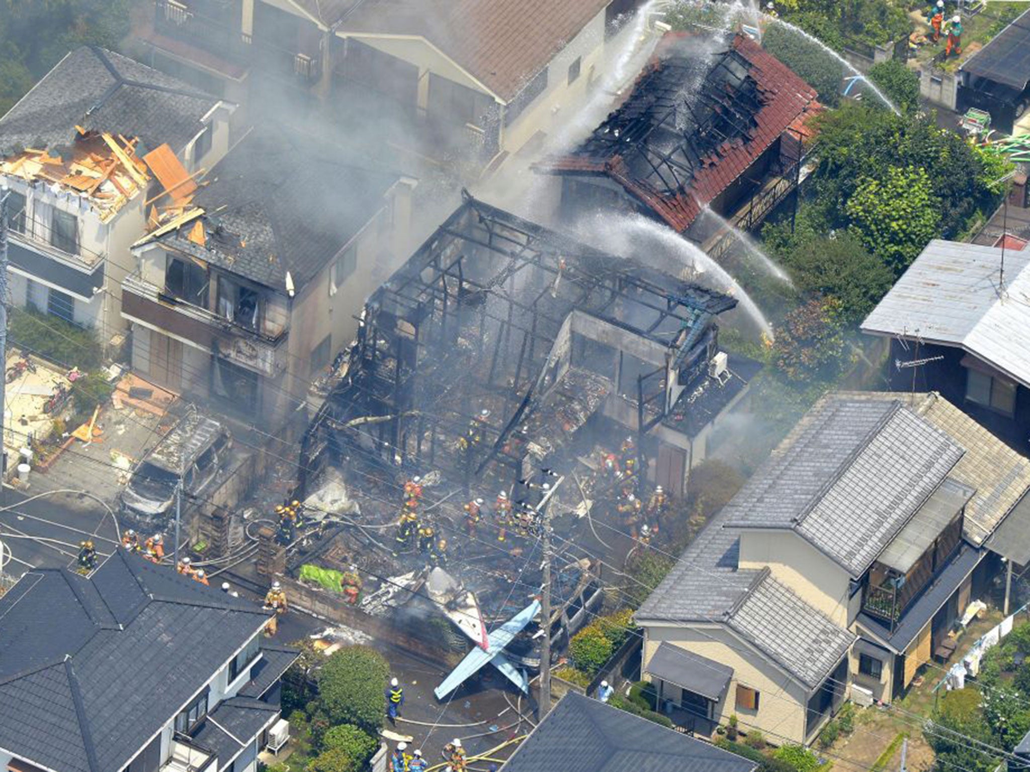 Five houses and two cars were set alight in the crash