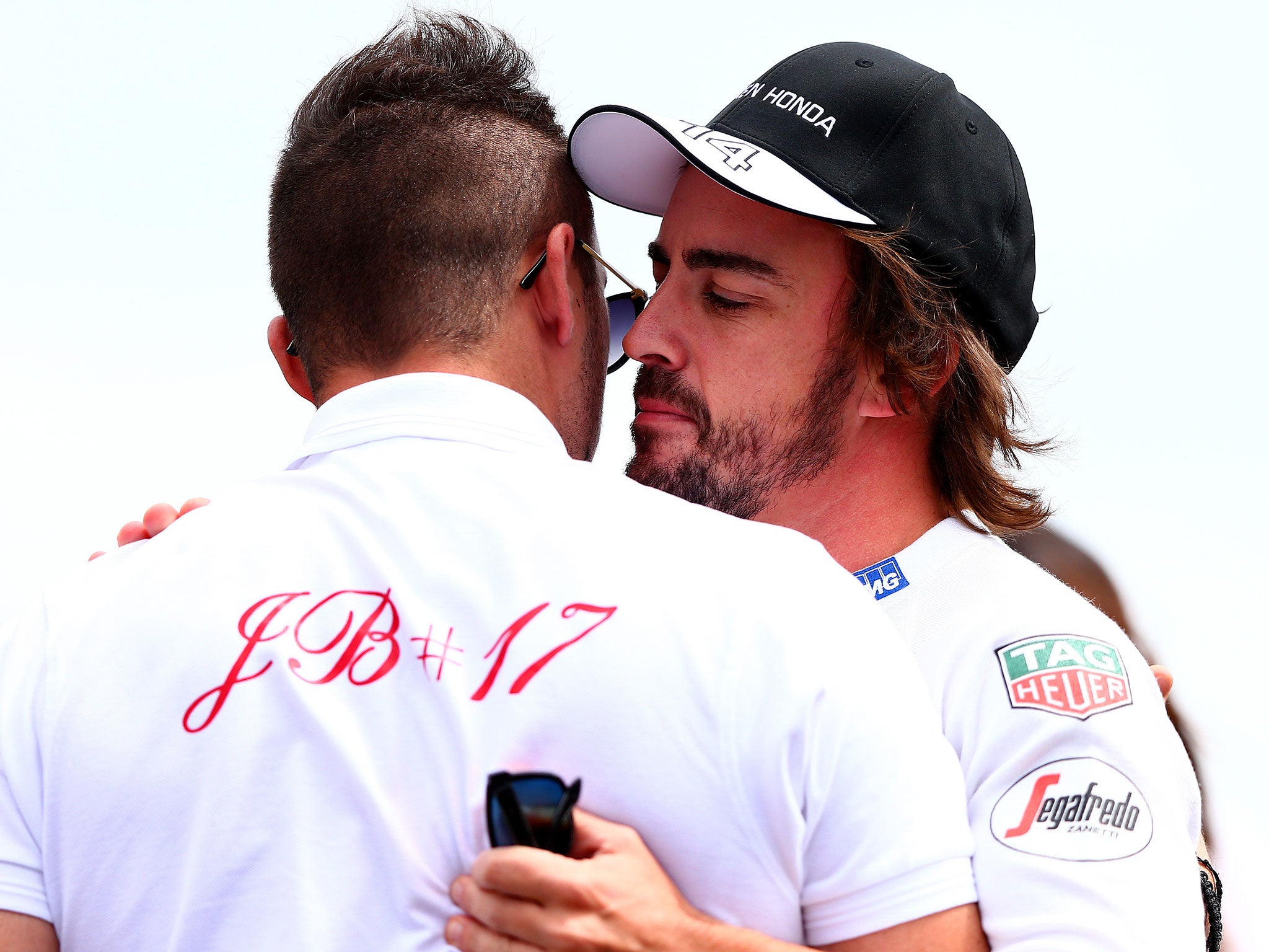 Fernando Alonso of Spain and McLaren Honda comforts Jules Bianchi's brother Tom