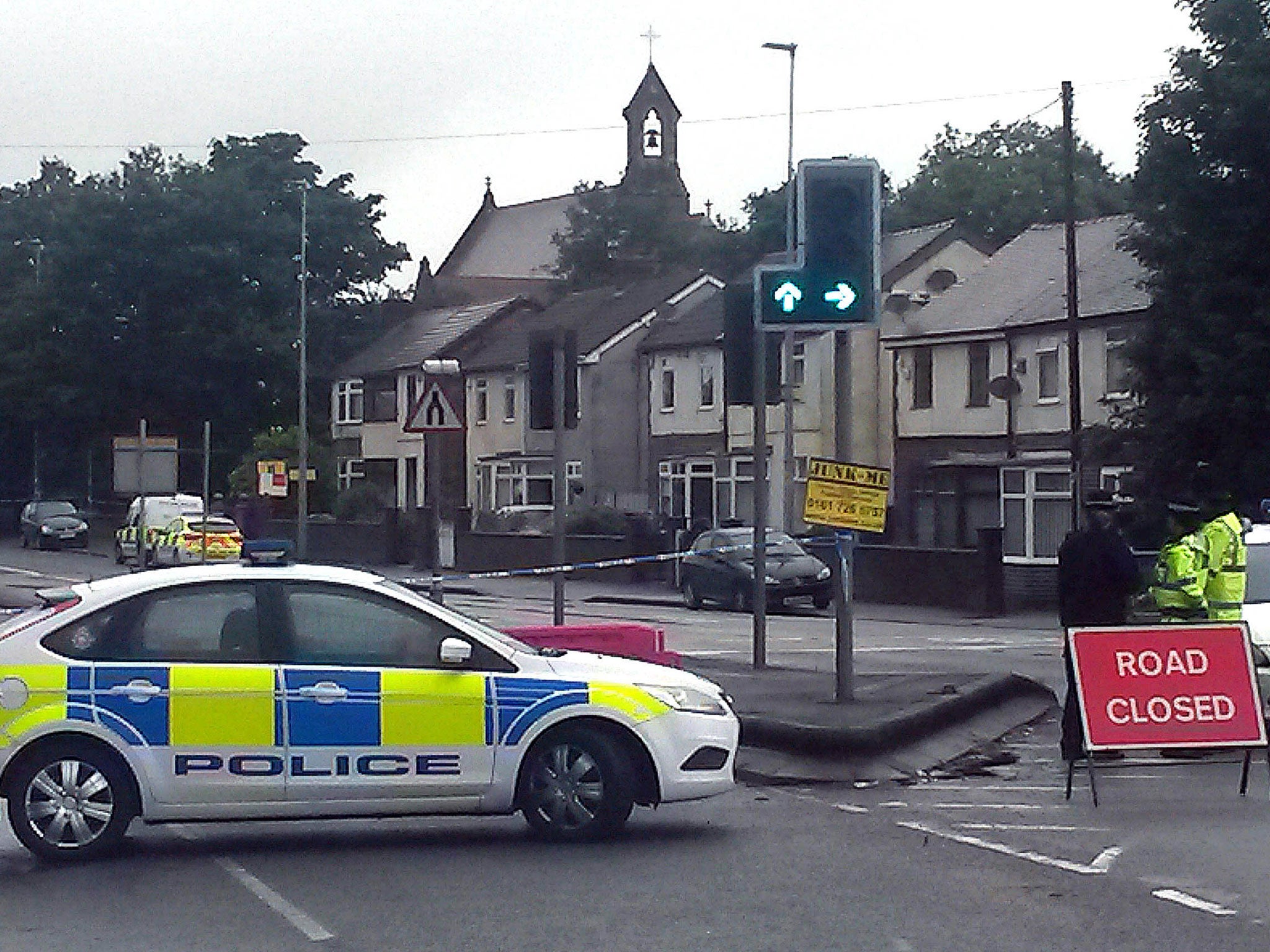 Police at the scene in Clifton, Salford, after businessman Paul Massey was shot dead at his house last night