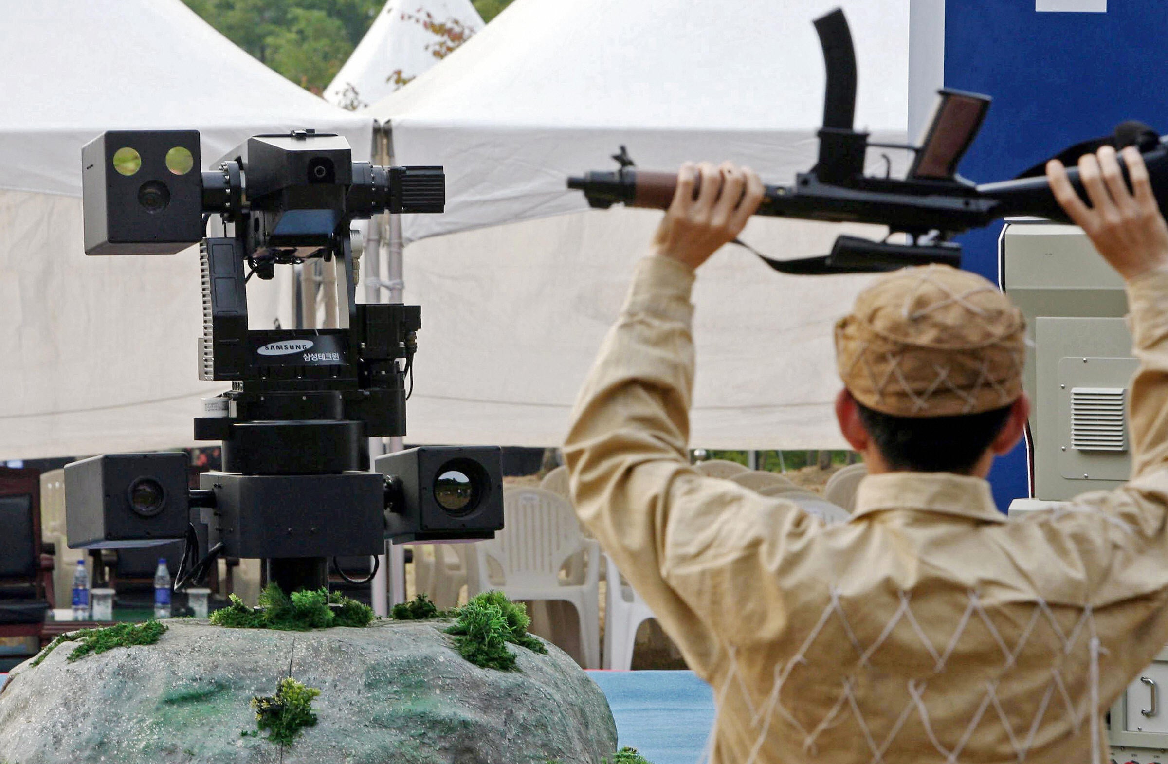 Sentry robots like these are currently in use by South Korea along the North Korean border - but cannot fire their weapons without human input