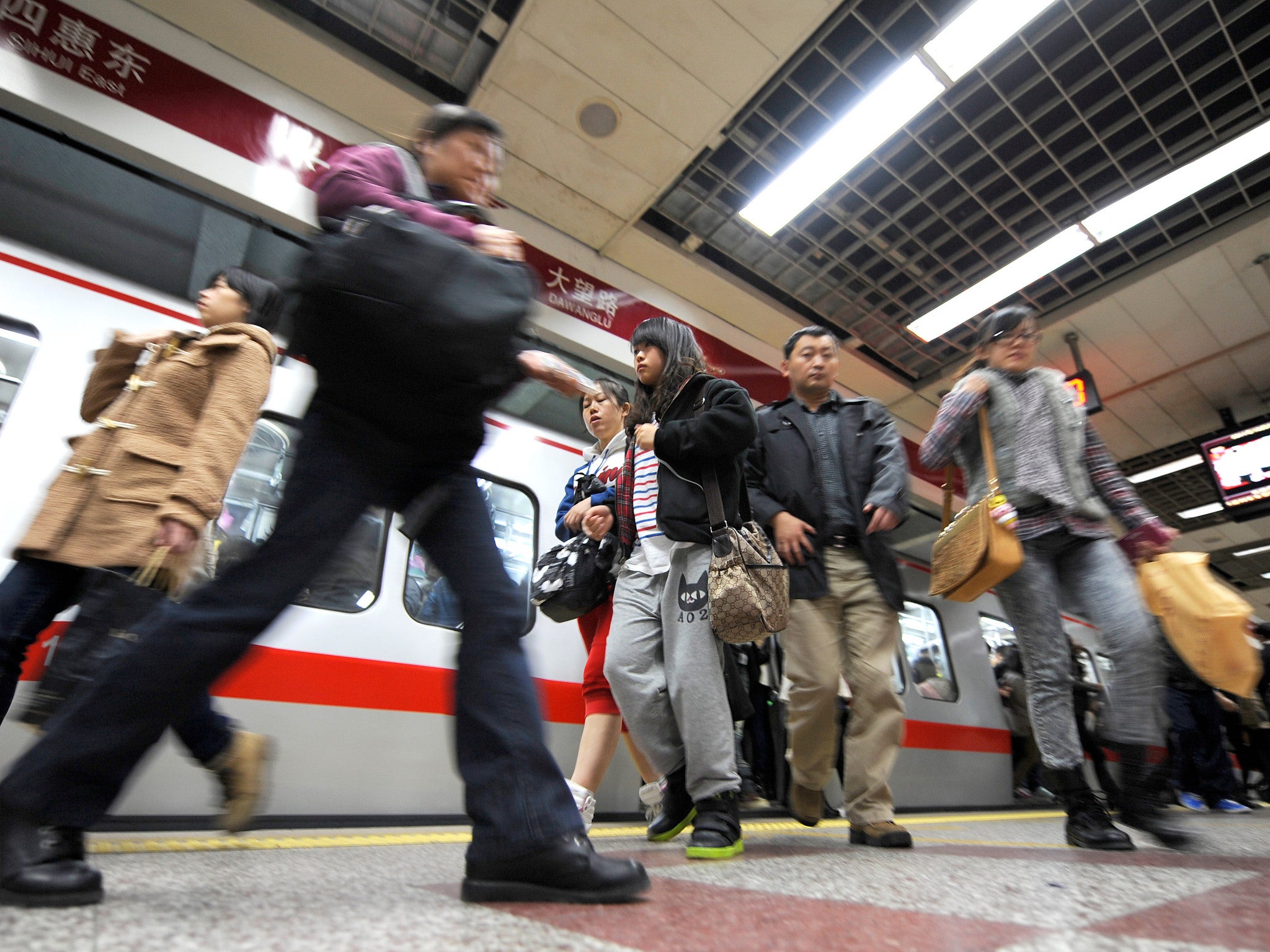 A woman was selling hugs for £1 at a subway station in China