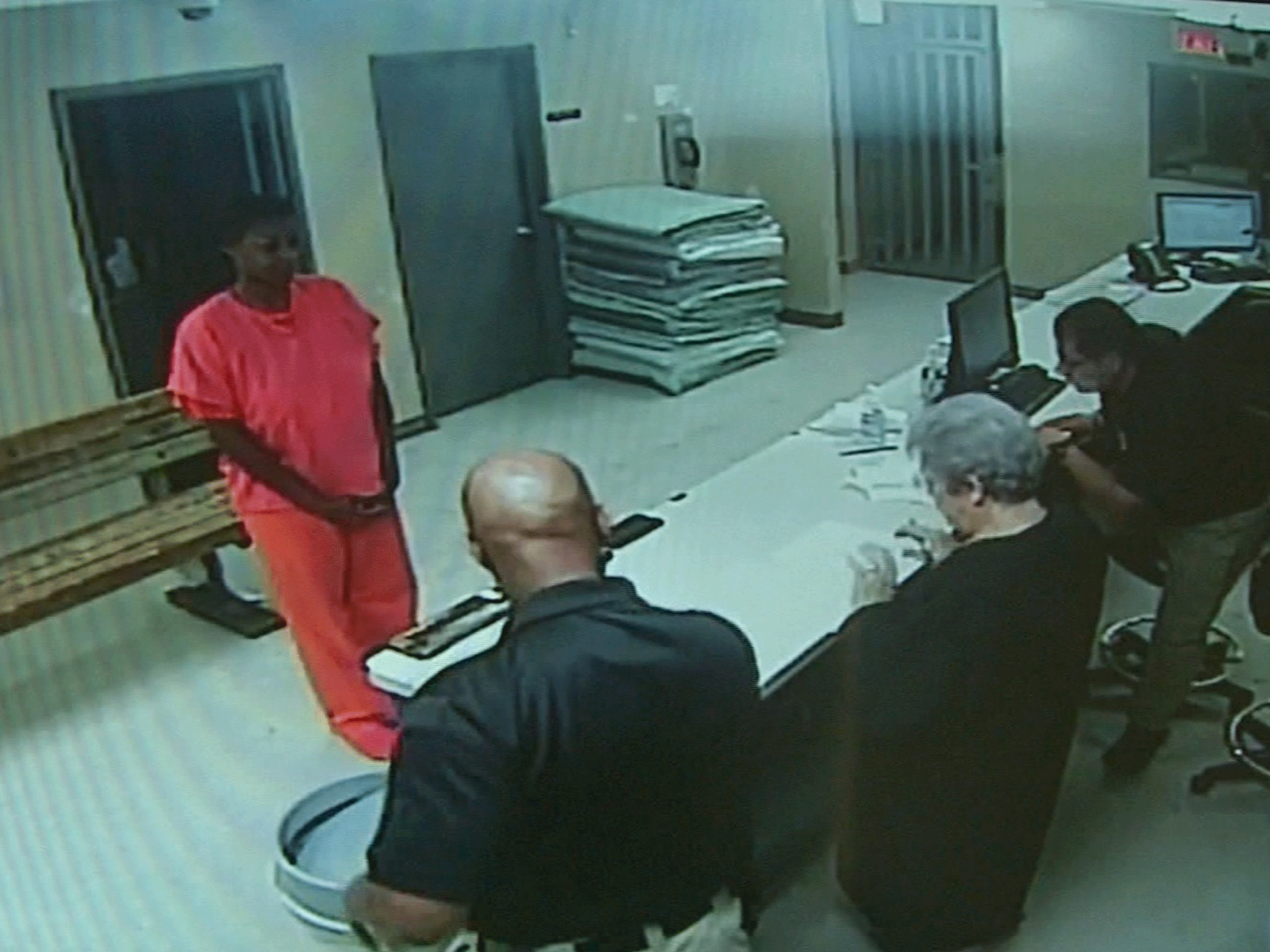 In this undated frame from video provided by the Waller County Sheriff's Department, Sandra Bland stands before a desk at Waller County Jail in Hempstead, Texas (Waller County Sheriff&amp;#039;s Department via AP)