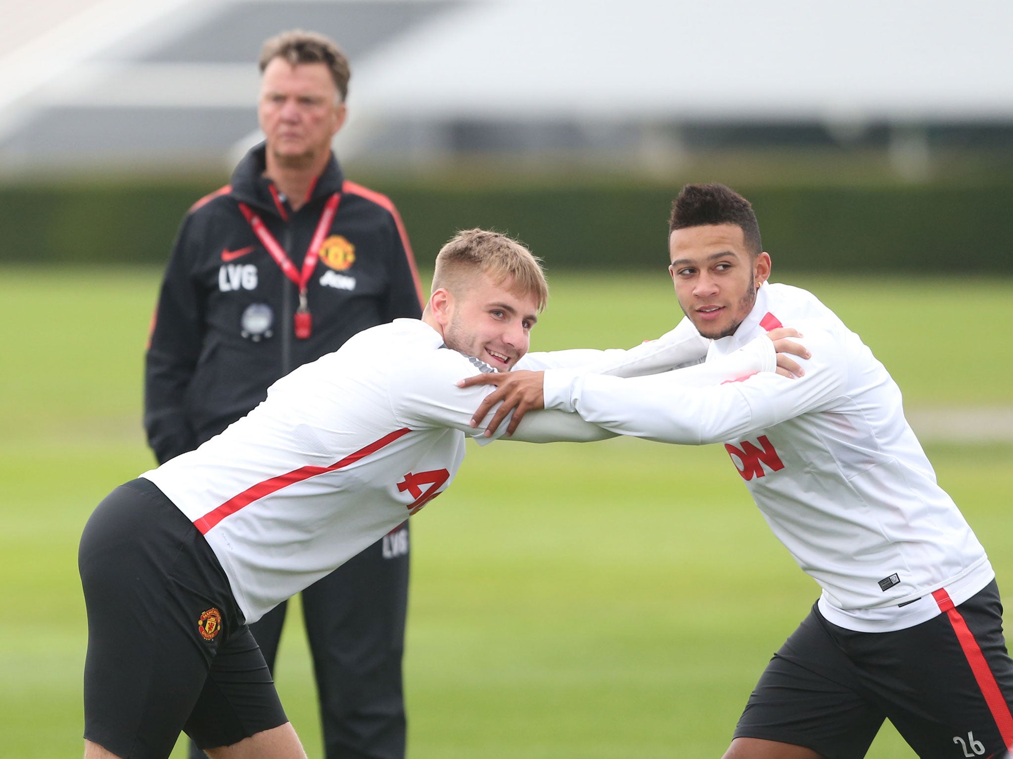 Luke Shaw and Memphis Depay train in front of Louis van Gaal