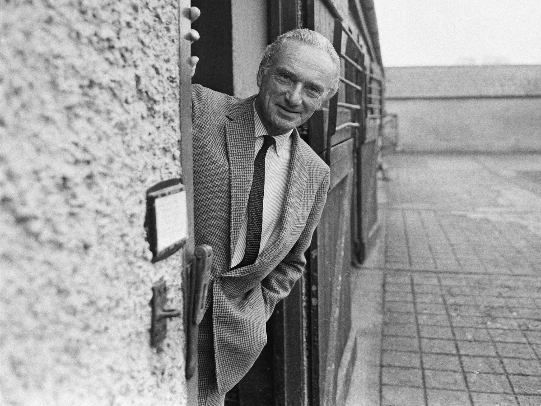 Irish horse racing commentator for the BBC, Peter O'Sullevan, pictured at a stable in 1969