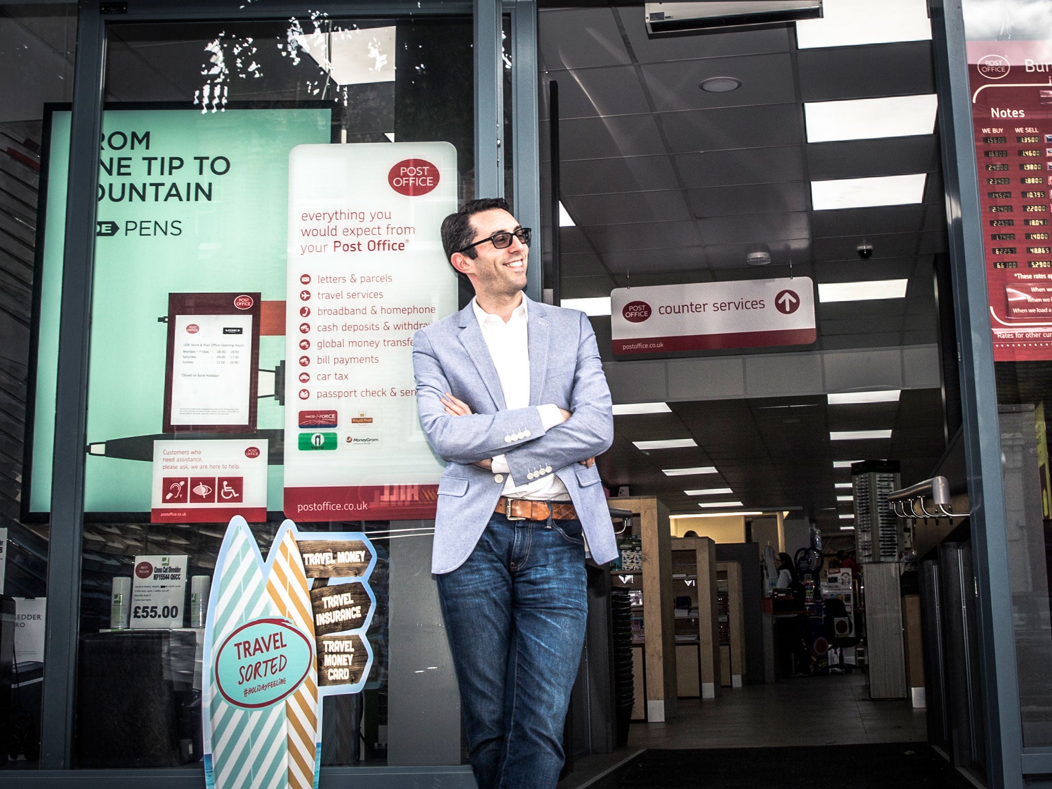 Elliott outside his stationery store that houses a Post Office